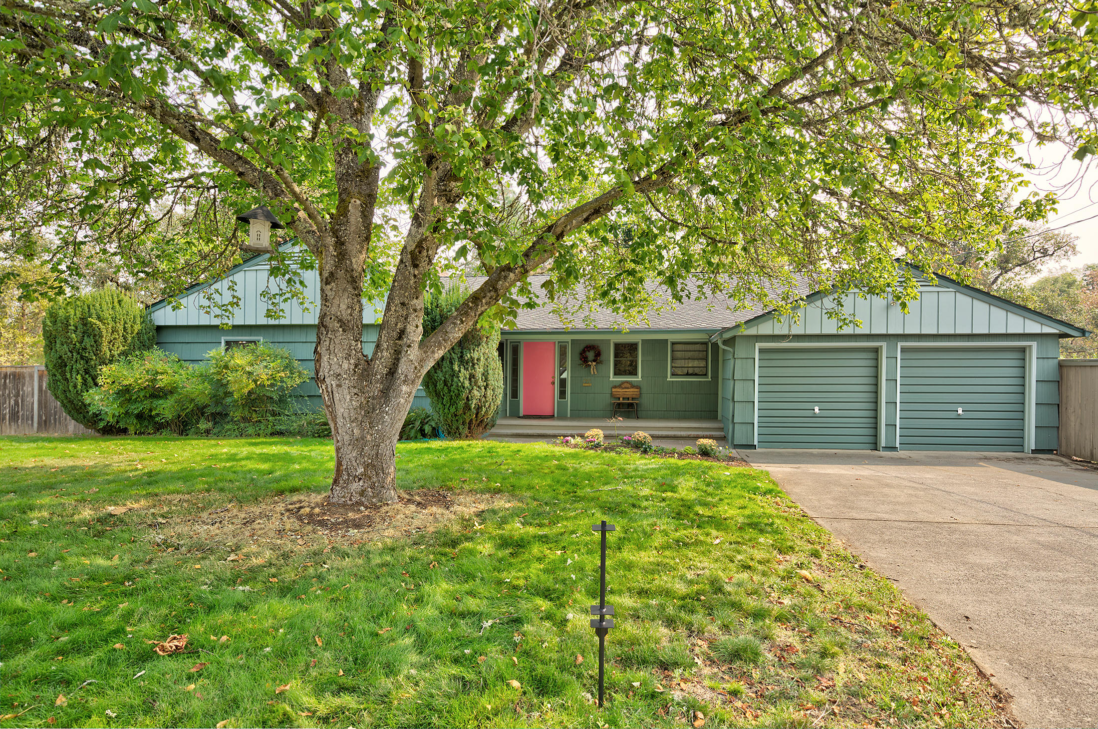 Welcome home to this mid century gem, built in 1948. There is original hardwood throughout most of the living space and beautiful unique built ins all throughout the home! You can enjoy the large windows to look over your .4 acre lot, with in ground pool and pool house with a full bath. There is also a fenced and gated garden and that's not all! There is a complete extra living space downstairs with its own entry. This is a perfect set up for multi-family dwelling. Upstairs is 3 bedroom, 2.5 bath, laundry room, Master suite, 2087 sq. ft. Downstairs, is complete with one large room, full bath, laundry, kitchen, dining and living area 600 sq. ft. This home is a MUST SEE, and such a rare find right in the heart of Grants Pass.