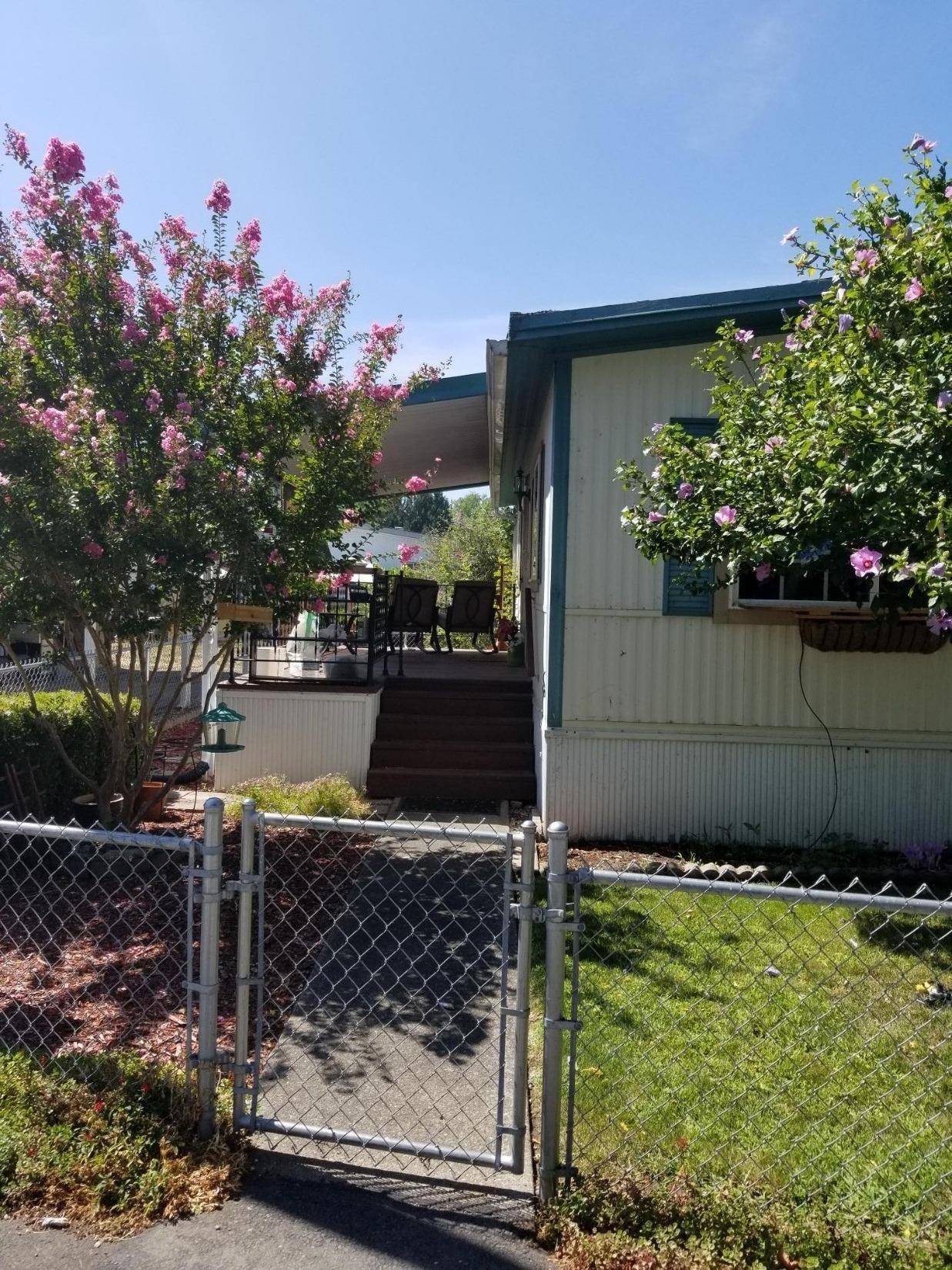 2 Bdm, 1 full ba, Doublewide in quiet Senior Park with beautiful surrounding blooming trees and flowers. Park has Rogue River access with new fishing deck. For information purpose only, MFG home only, NO land included. OR BCD dealer license required to list/sell.