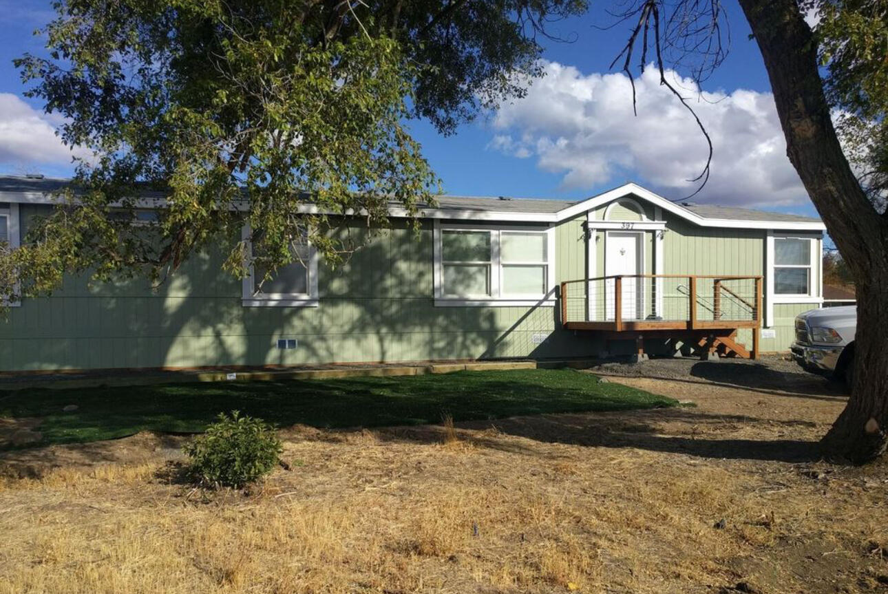 Rare opportunity! This unique detached duplex features two separate manufactured homes on one tax lot. The front home offers 3 bedrooms, 2 baths, and approximately 1,782 sq ft, plus detached garage and generous living space. The back home (tan in color) includes 2 bedrooms plus an office/den, 2 baths, and approximately 933 sq ft with a newer storage shed, and newer interior finishes.

Perfect for multi-generational living, rental income, or house-hacking—live in one and rent the other, or add both to your investment portfolio. Seller will consider carrying the contract with large down payment, 6% interest, 15 year amortization.

A truly versatile property with strong income potential and flexible living options!