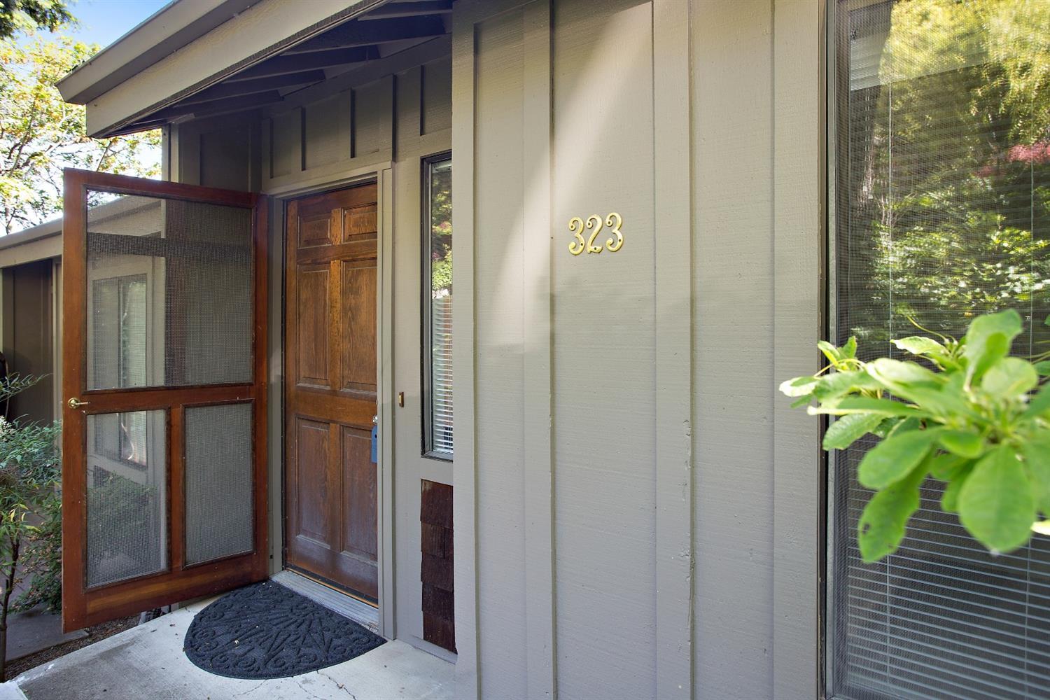 Light and airy upgraded Ravenwood Townhome is above the heart of Ashland's theater and restaurant district. Gorgeous views of Grizzly and downtown from Master suite and deck. Wood cabinets, recent bathroom updates. Decks off 2 levels, parking and laundry and storage room in carport under unit. Private path to pool and private gated access to downtown from the Ravenwood Townhomes. Great homeowners association.