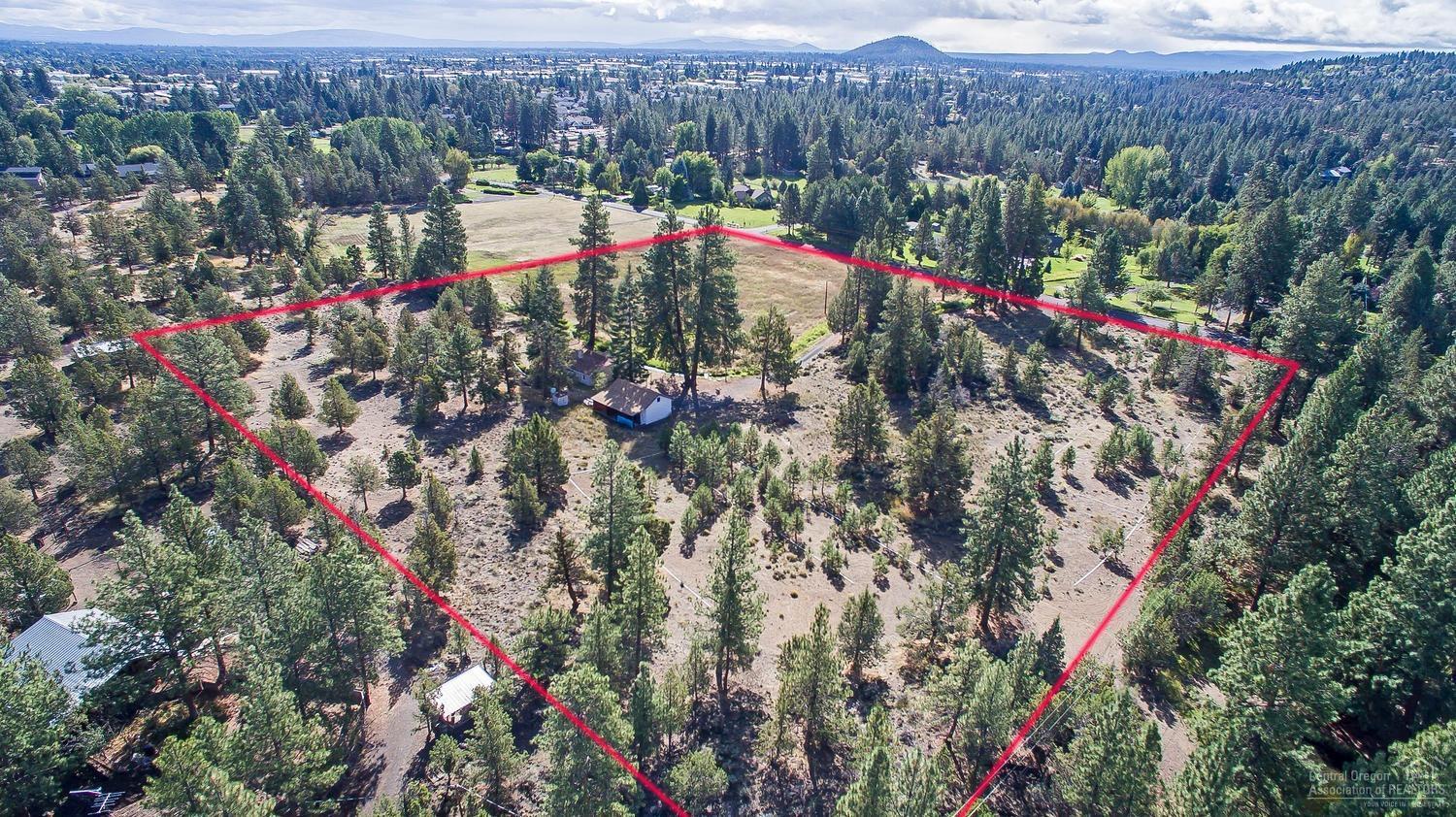 3 Family Compound? 1,2 or 3 Buildable Lots? Look at the versatility! This 9.41 acre parcel is comprised of 3 legal lots of record. All are potentially buildable NOW (subject to septic feasibility, lot line adjustment and usual permits from county). Or there could be two homes built on 4+ acre mini-estate parcels. Please confirm all info with Deschutes County. This is an exceptionally fine area of small irrigated acreage properties, very close to city limits and all services, but with a distinct rural flavor. Riley Ranch Nature Preserve Park is at the end of Glen Vista Rd., and the newest elementary school, North Star Elementary, is just up O.B. Riley Rd. The older house on the property is functional and livable, and there's a nice size garage.