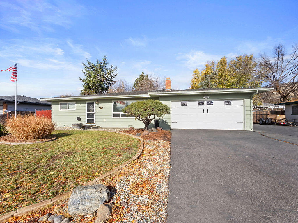 This ''light and bright'' beautifully maintained 3 bed, 2 bath home has QUALITY features throughout. Spacious living room has a fireplace with gas insert; Kitchen has custom cherry cabinetry and granite counters; Roomy primary bedroom with on-suite bath; Primary bath has a beautiful, tiled tub/shower with clear glass doors; Hall bath has tiled, oversized walk-in shower, Windows were recently replaced. The large living room window has a reflective wrap for temp. control and privacy; Living room is carpeted, Hallway and 3 beds have simulated wood floors; Dining, kitchen, utility, and both baths have tile floors. This home's added bonus is the HUGE enclosed screened-in porch off the dining sliders. There's a large, framed utility building in the back yard and the driveway side yard is wide enough to easily access the back yard or park an RV. This quality home is a ''Standout''!
