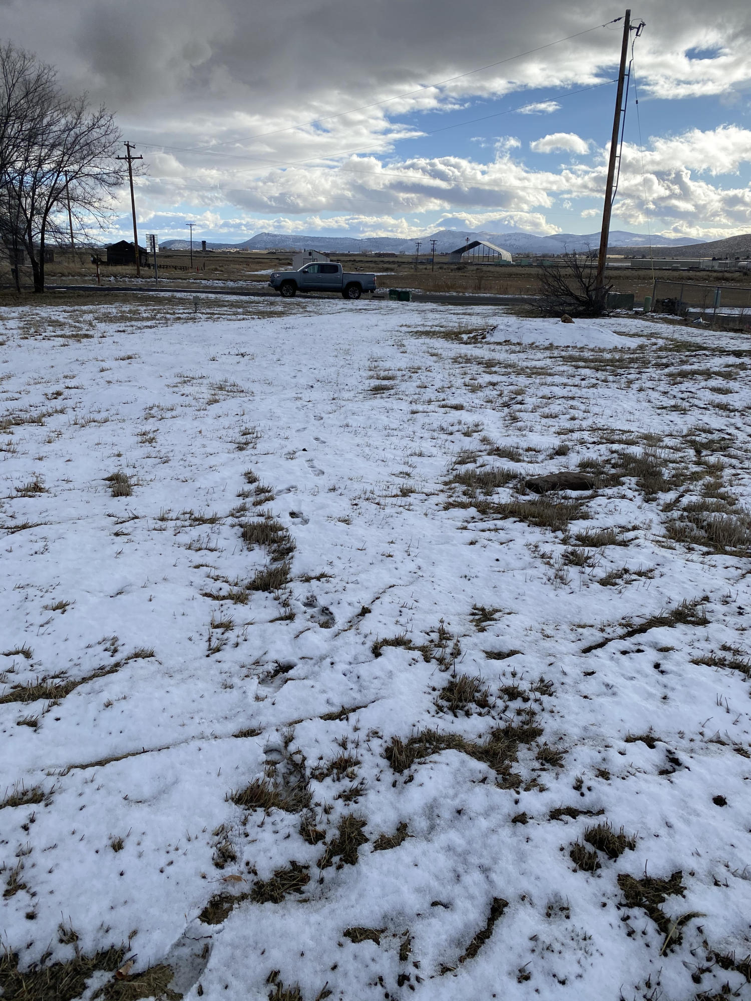 Take a look at this Half Acre Lot in the suburbs ! Utilities at the street for water and sewer, ALSO a well on the property per the seller. This property is fenced on 3 sides. Buyers to perform all due diligence for utility costs as well as building or placing a manufactured home on the property.