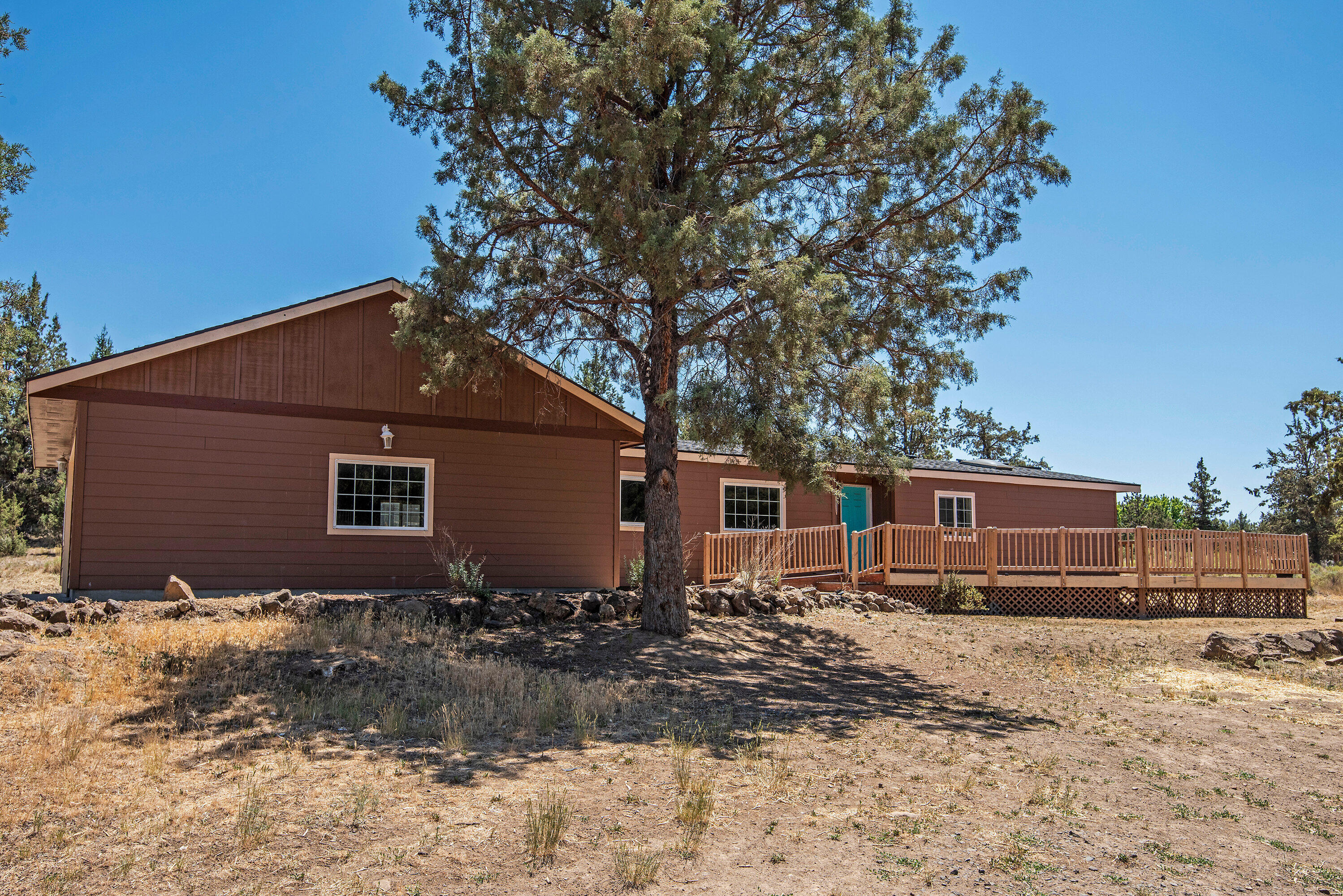 This charming home has so much to offer. Inviting floor plan with open concept in the heart of the home. Large kitchen with ample storage and large island, w/newer wood-lam flooring throughout kitchen and dining area, vaulted ceilings makes for a spacious feel. Huge deck with brand new deck railing in 2019 is perfectly situated to view the 1.08 acre property. The over-sized 2+ car garage would make for a perfect shop for all the toys! Crooked River Ranch offers great owner amenities that include pool, tennis/pickle ball courts and disc golf. CRR also has a top ranked golf course! Enjoy the great outdoors w/close proximity to hiking trails, fishing, boating, skiing, rock climbing, equestrian trails and parks!