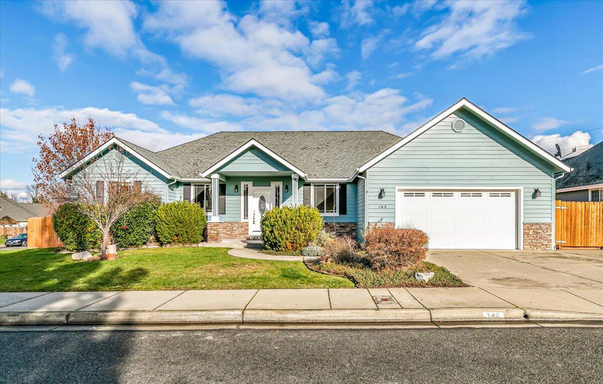 Standout home in a sought-after golf-course neighborhood with golf course access! This dramatic split floor plan offers 3 bedrooms, 2 bathrooms, plus a versatile den/home office that can serve as a possible 4th bedroom. Vaulted ceilings create an open, airy feel in the living room, kitchen, and dining areas, while coffered ceilings elevate the primary suite. The spacious kitchen shines with granite slab countertops, stainless steel appliances, and a walk-in pantry. Bamboo flooring, a warm fireplace, and oversized rooms add comfort and style throughout. The primary bath features a relaxing jetted tub, separate shower, dual vanities, and two closets. Enjoy a private fenced backyard and convenient RV parking with 13.8' x 47' storage space, along with direct golf course access.