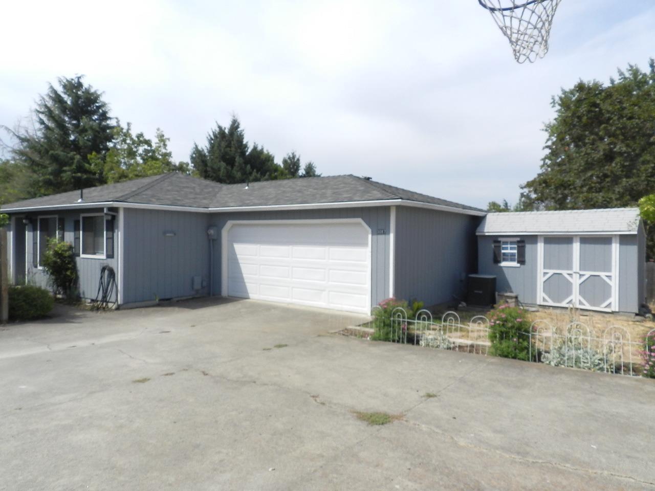 Tucked away in this sweet little East Medford neighborhood is this adorable 1986 2 bedroom 1 bath home on a large .18 acre lot with a garden shed, fenced garden area and a 2 car garage. The interior is fresh and clean, with a nice open concept, and a cute updated bathroom. There is a covered back deck and plenty of trees & bambu surrounding for privacy. Very sweet home and awesome area close to shopping and schools.