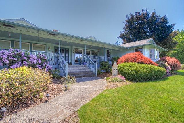 You can have it all! Sprawling 3148 square foot ranch home offers a beautiful panoramic view of the valley from this elevated knoll. But wait there's more city schools, irrigated pasture AND a shop plus a barn. One owner home has been meticulously cared for and is framed by three acres of green pastures and white fencing. Spacious three bedroom/2.5 bath home features formal and informal space for quiet evenings by the fire or entertaining large groups. Beautiful custom built-ins in the living room and a wood burning fireplace back-to-back with a pellet stove keeps you warm and toasty. Storage is abundant here, not just in the kitchen but tucked under window seats and everywhere you look. Plenty of room to park at least a half dozen vehicles, a finished shop and an RV port with all the hookups plus a barn with stalls. But the best part is sitting on the front porch, soaking in the view.