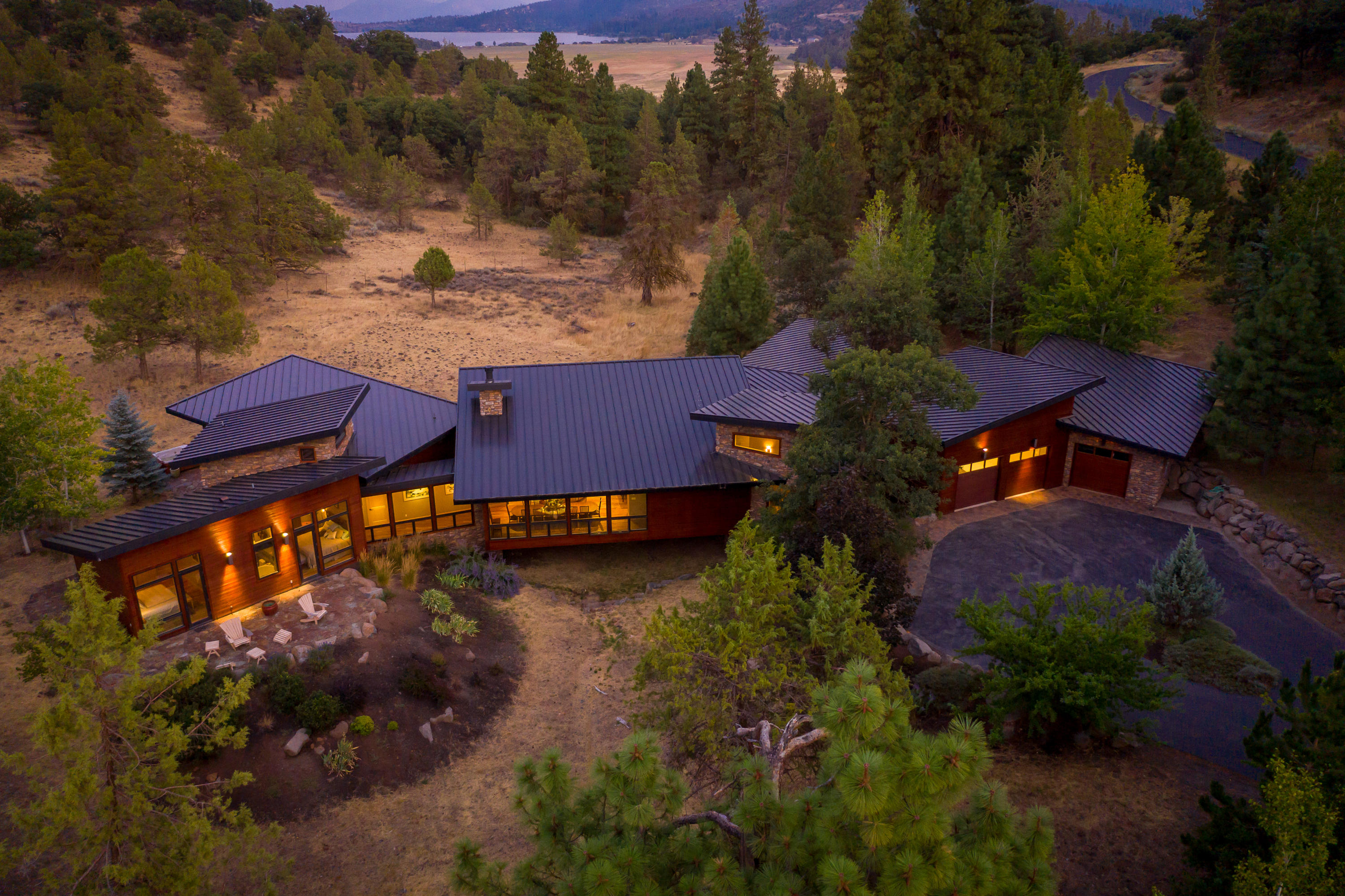 Presenting the 'JEWEL' of the RUNNING Y RANCH RESORT! This magnificent estate is truly a private sanctuary with an array of wildlife that meanders through giving you that feeling of immense tranquility.  The architecture is Northwest Contemporary & the stunning floor design blends in perfectly to the environment.   The outstanding patios offer a beautiful setting for outdoor entertainment.  The kitchen features top of the line Wolf Appliances & the island bar seats 12 easily for indoor entertainment.  The spaciousness of the interior of the home and exterior combined offers abundant entertainment potential.  All exterior & interior construction products are top of the line to include radiant heated flooring. The focal point of great room is a beautiful artist-designed fireplace. You will absolutely love the breakfast nook & office areas. There are many custom features throughout-even a temperature controlled wine cellar!   Per seller building costs were more than $2.5 million!