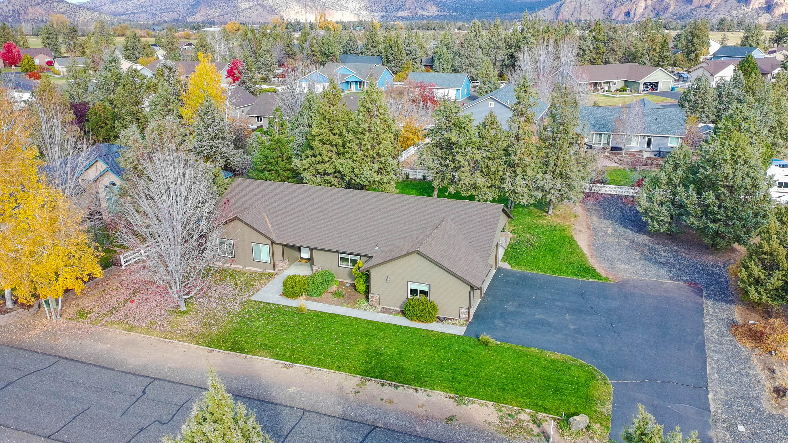 Must-see custom one-story home in sought-after Angus Acres! Ideally situated on a spacious .53-acre lot w/plenty of room to add a shop or detached garage. Home features an open floorplan w/tall vaulted ceilings and custom hardwood flooring in the main living spaces. Updated kitchen showcases granite tile counters, a breakfast bar, ample counter space and abundant custom cabinetry for storage. Relax by the cozy living room fireplace or retreat to the spacious primary suite complete w/vaulted ceiling and dual walk-in closets. All bedrooms are generously sized ensuring comfort for all. Additional highlights include a finished 3-car garage, dedicated laundry room w/utility sink and wall cabinets as well as RV parking w/extra space for toys! Step outside to a private outdoor oasis featuring mature trees, a large patio ideal for entertaining & beautifully landscaped yards. Don't miss this opportunity to own a custom home in a peaceful, established neighborhood w/room to grow and play!