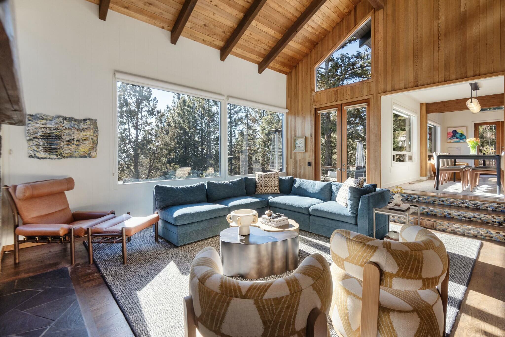 Nestled on a spacious .5-acre lot in the West Hills, this south-facing home offers a bright and airy atmosphere with an open floor plan, vaulted ceilings, and exposed beams throughout. Large windows invite natural light and a view of Mt. Bachelor from the kitchen. Every bathroom has been remodeled and updated, bringing a fresh, modern touch to the home. A standout feature is the 288 SF remodeled guest studio, offering the perfect private retreat for guests or a quiet workspace. The outdoor space is ideal for entertaining with a large deck, salt water hot tub for aprÃ¨s-ski relaxation, and a newly renovated pickleball court for year-round fun. The attached garage includes additional space for a workbench, while the heated driveway ensures convenience in all seasons. This home blends functionality with luxury, making it an ideal place to live and entertain. Don't miss the opportunity to own this exceptional property!