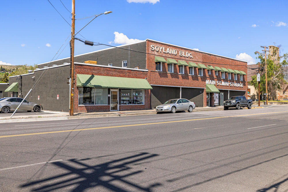 Please do not disturb tenants. The Soyland Building is a versatile investment opportunity in the heart of Klamath Falls. This mixed-use property includes 11 apartments, 2,700 sq. ft. of retail space, and a 116-unit self-storage facility. A private geothermal well provides low-cost heat to both residential and commercial units. Zoned GC (General Commercial), it also includes a fenced 50'x40' vacant lot with potential for rezoning—ideal for POD-style storage. Recent upgrades include a WeatherBond roof (2017) and extensive electrical work by Winema Electric. Separately metered. Strong income potential, diversified tenant base, and a prime Main Street location.