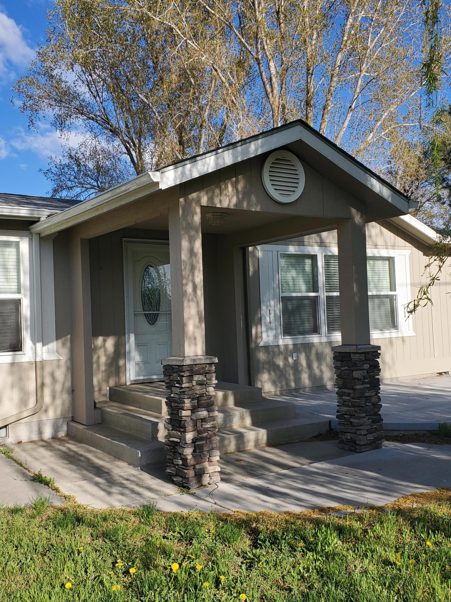 Country living in the South Suburbs! This wonderful 2006 manufactured home on a permanent foundation is located on 0.23 acre lot. This home features a large, open kitchen - a spacious living room, and great master suit. There is also a 2-car attached garage for ample storage. Has a shared well.