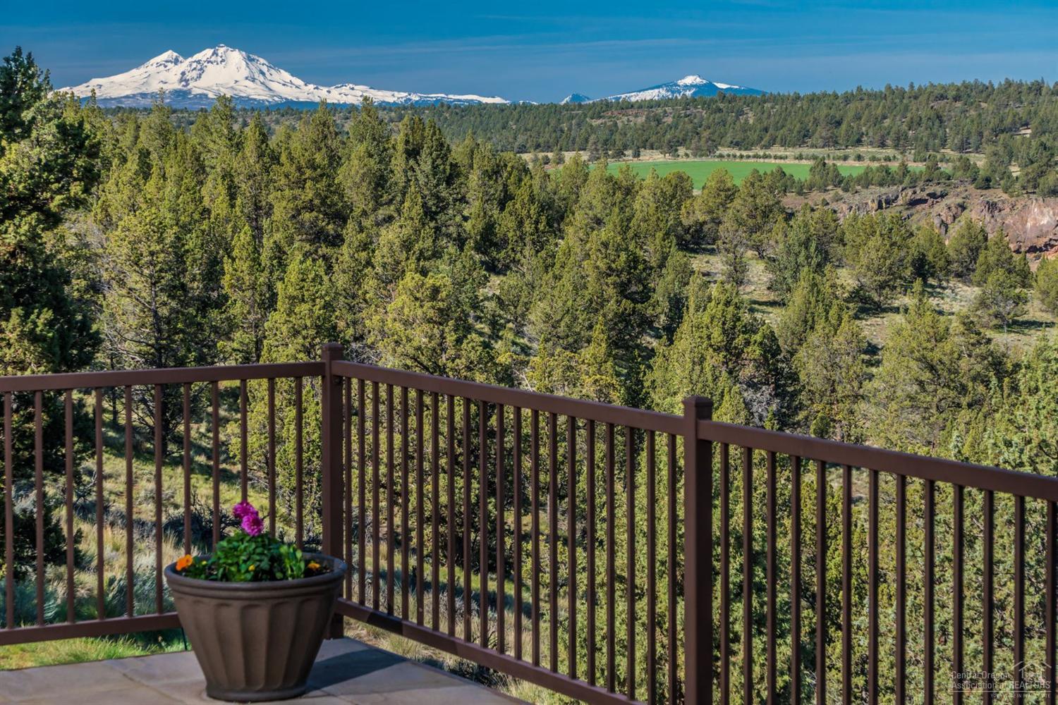 Stunning panoramic Deschutes River Canyon and breathtaking Cascade Mountain views completely envelope you the moment to enter this gorgeous custom home. Enjoy the spectacular High Desert seasons indoors and out from this single level wide open home with enormous windows to watch the eagles soar. Stacked stone fireplace, granite counter tops, deck off the master and separated sleeping spaces perfect for guests are just a few of the great details. All that Crooked River Ranch has to offer; golf, swimming,etc.