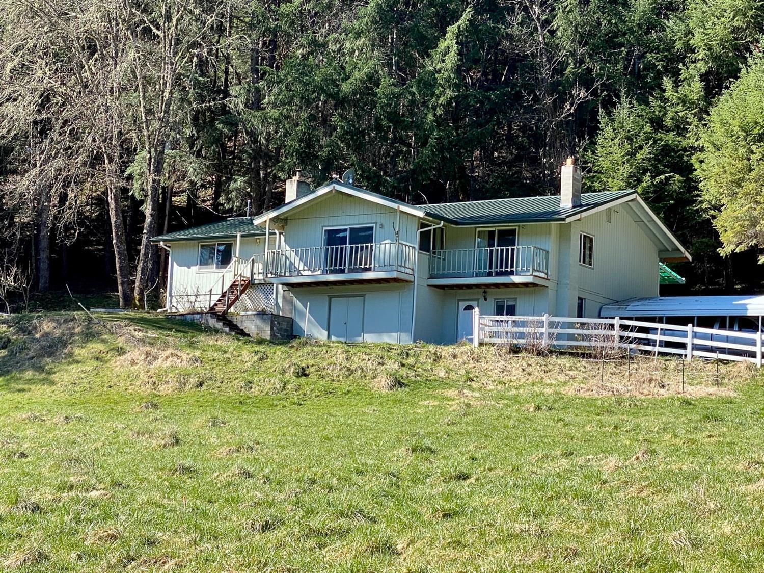 Looking for a home with privacy and usable EFU farm ground with irrigation off a year-round creek? You have found it! Bring your livestock and live on your dream property. Come and enjoy the abundant wildlife, views of the mountains, with peace and quiet on 18 acres backed by BLM. The property is bisected by the West Fork of E. Evans Creek with plenty of free water for irrigating two productive pastures and the large fenced garden area. The 3130 sqft home features a great room style living room open to the kitchen and formal dining room. Three large bedrooms with two full baths. Large laundry plus a workshop area. Updates include a new metal roof and fully remodeled master bathroom. The 420 ft deep well produces 9.62 gallons per minute per well logs. The certified wood insert stove was installed five years ago and there are plenty of trees in your own woodlot to keep you snug by the fire. There is even a barn and large chicken coup. You don't want to miss out on this property.