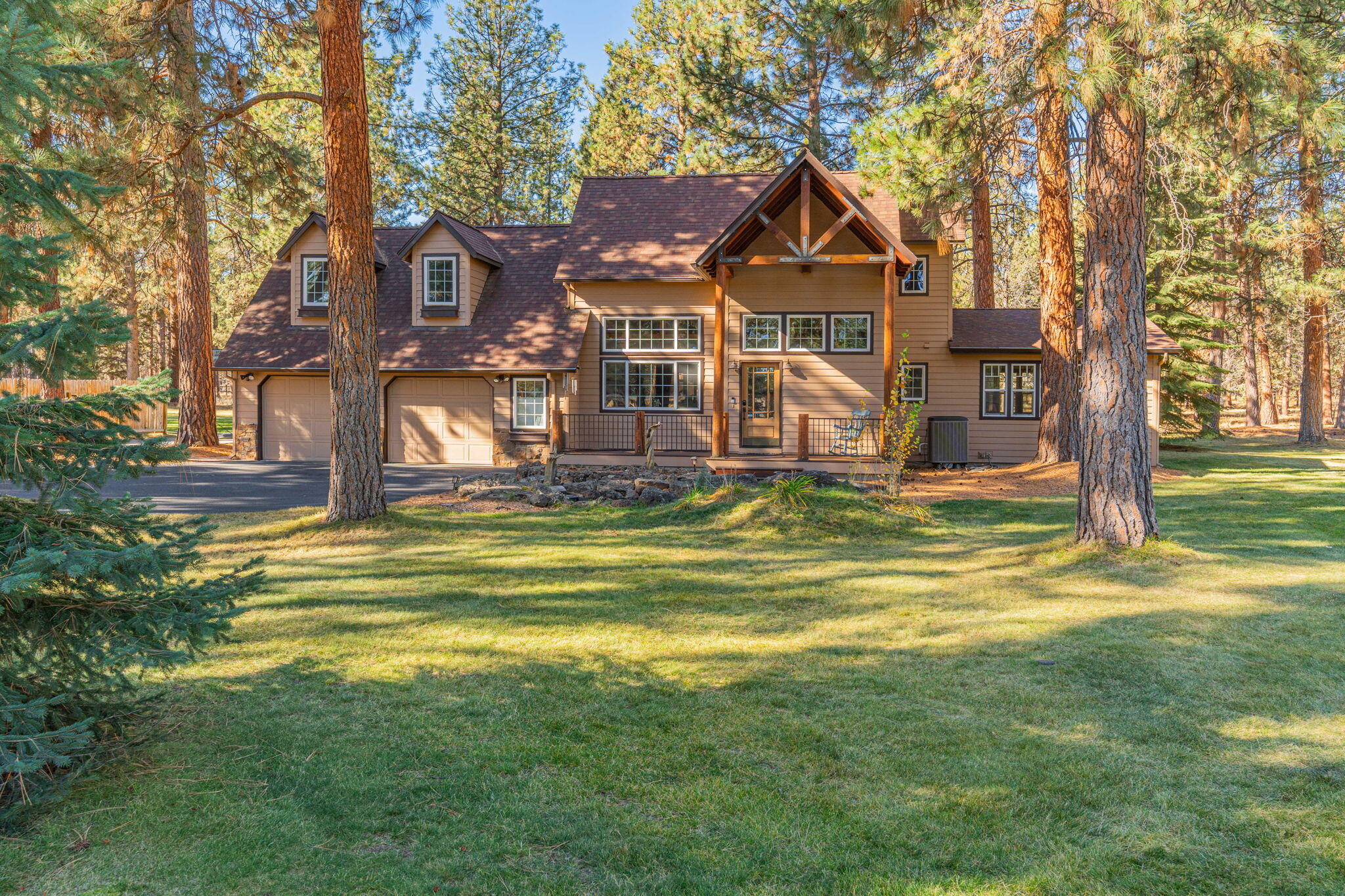 Situated in a park-like setting on just under 2 acres, this beautiful home offers the rare opportunity to own natural acreage, conveniently located close to town & just minutes from westside schools, parks, shops & restaurants.With abundant windows connecting to outside spaces and natural light, this property features an open kitchen, updated with quartz counters & connected to a den, just adjacent to a charming dining room. Accessed through lovely arched openings on both sides, the main living space is completed with a lovely vaulted great room, with warm wood planking on the ceiling & a natural stone fireplace. On the main level, there is also a newly built ensuite with its own bathroom. Upstairs you will find the primary, as well as 2 additional guest rooms and a spacious loft. The property includes a large fenced garden area, tree house and an additional storage building that could be converted to a home office or hobby room.So many possibilities on this little piece of paradise!