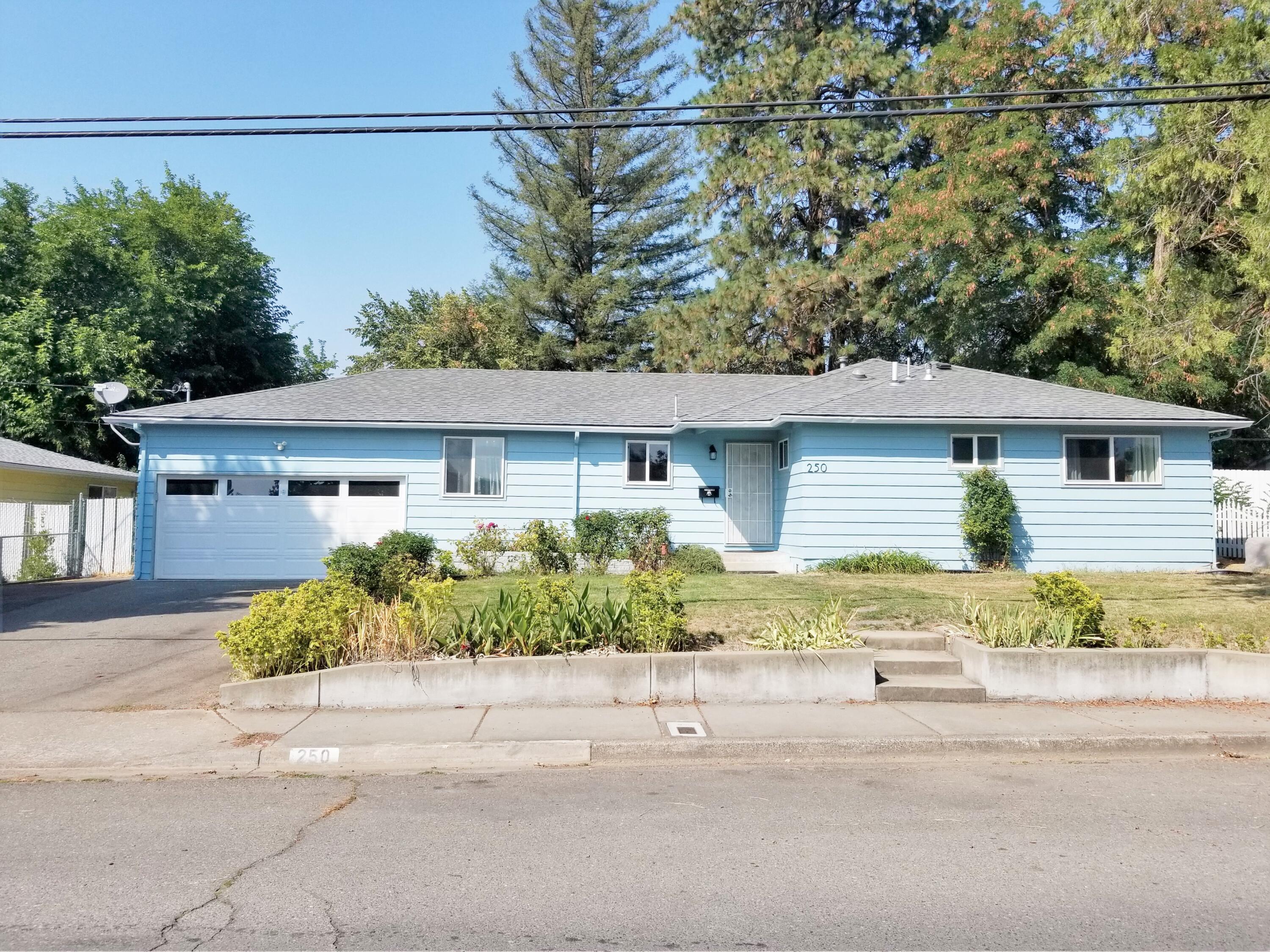 Comfortable home in the quiet NE part of Grants Pass.  3bd, 2bath, 1636 SF on .19 acres.  Many updates to the house within the last four years:  new roof, double paned vinyl windows, gas range, dishwasher, garbage disposal, kitchen floor, front door, all interior doors, garage door, garage door opener and more.  House has large living room with certified wood stove insert and a separate family room that leads to the nice sized fenced backyard. Large bedrooms. Extra large, attached garage and wide driveway for off-street parking. Hardwood floors throughout.