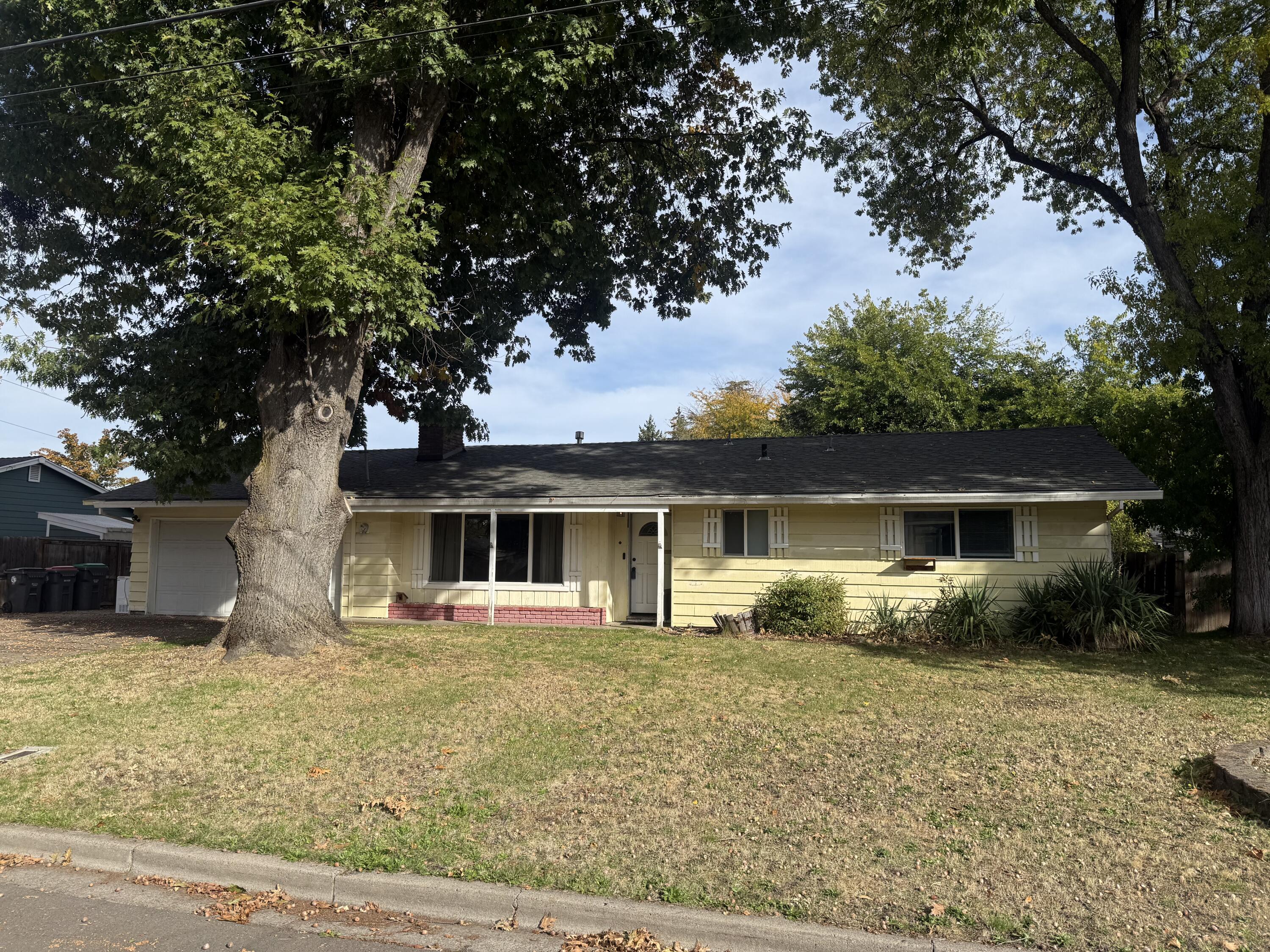 Bring your tools and vision for this diamond in the rough! This 3-bedroom, 2-bath home has great bones, featuring hardwood floors, a cozy fireplace insert with a wood-burning option, and an oversized kitchen complete with appliances and a bay window. The spacious backyard offers plenty of room for outdoor living, gardening, or future expansion. Whether you're looking for a renovation project, a rental opportunity, or a Fantastic Flip for a Cash Buyer, this property is full of potential and ready for its next chapter!