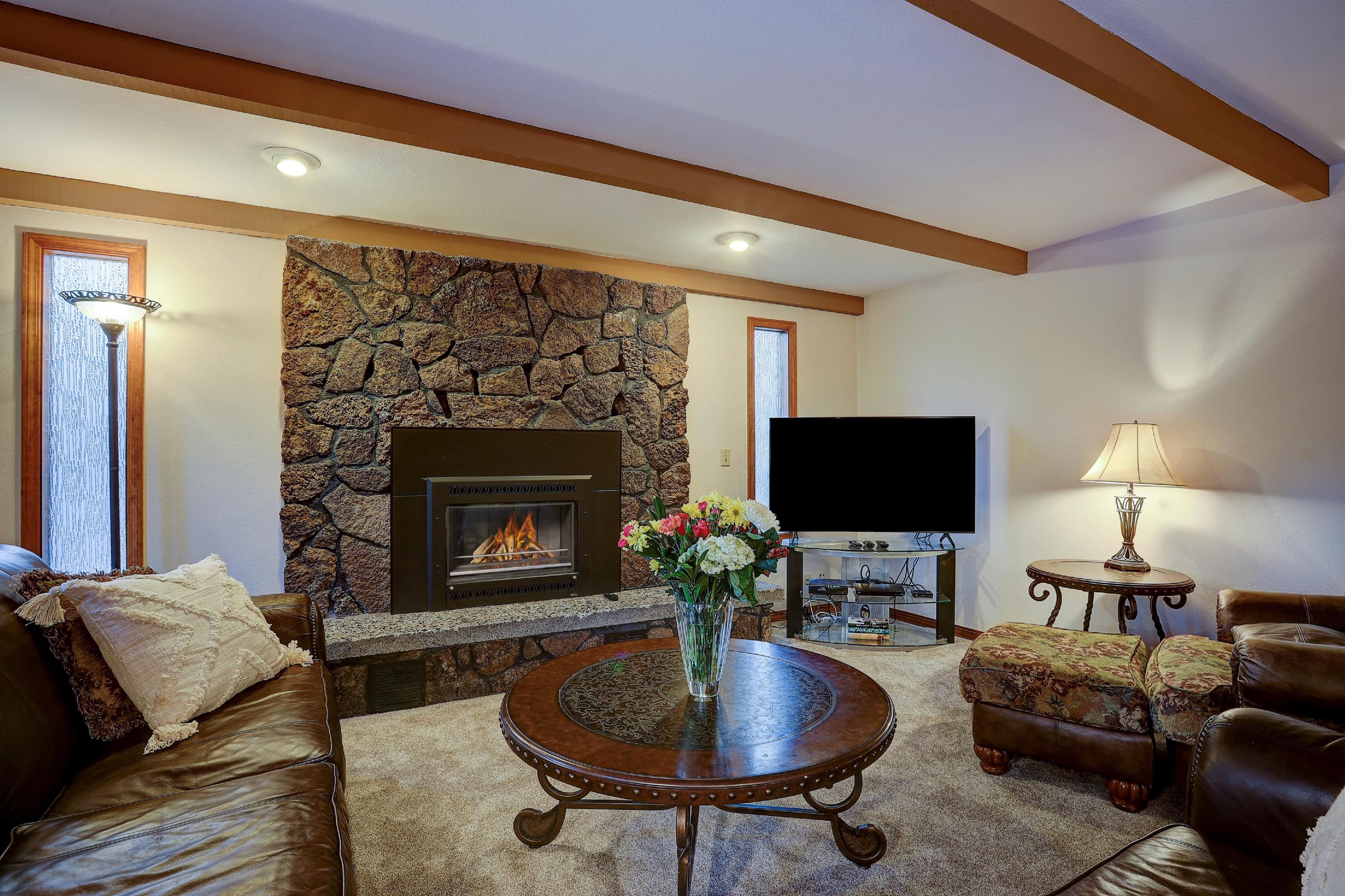 Ideal location in the woods near Fort Rock park in Sunriver, this gorgeous home is the retreat you've been looking for. Offering 5 bedrooms – two of which are master suites, there is plenty of space for everyone to feel welcome. Inside, lots of windows, wood beam ceilings & an open concept make relaxing & entertaining a pleasure. Every chef will love the bright kitchen with stainless steel appliances, granite counters, eat-in breakfast bar and adjoining dining area to feed the lot. Off the kitchen, another bonus space perfect for game nights or cozy movie watching.  Settle in to enjoy the spacious living room w/gas fireplace & hearth. Both luxurious master bedrooms feature upgraded spa style ensuite baths w/walk in shower and 2 vanities—one master is upstairs & one is below. Large garage set for ping-pong playing & toy storage. Out back, sit on the lovely deck that overlooks huge common space or soak away your adventures in the hot tub. Updates include new carpet, A/C, SHARC PIF.