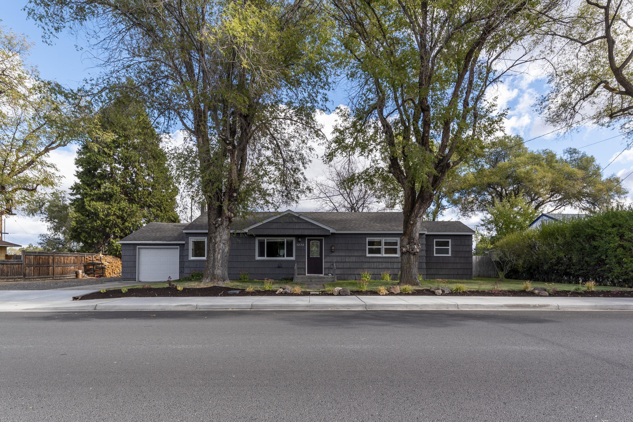 Don't miss this charming Redmond bungalow that is gardeners dream sitting on .25 acres. Enjoy the privacy of the large backyard that host a 800+SqFt garden along with additional raised beds, fruit trees and berry bushes that adjoins an alley and open space for the nearby school. The 3bdr, 2bth home has an updated kitchen, forced air w/AC and a new furnace in the past 3years. The roof was replace 8years ago with a 30 year roof and newer exterior paint. And don't forget to enjoy the sunroom all year around just outside your kitchen French doors. Open House canceled do to pending offer