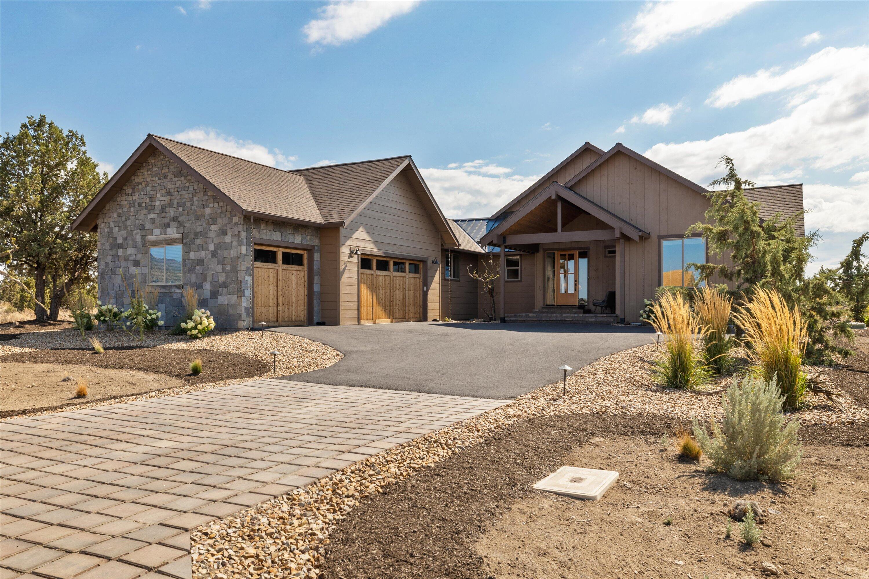 Beautifully bright single level NW Style home positioned on a quiet cul-de-sac that abuts to over 20,000 acres of BLM land at Brasada Ranch. Custom finishes are felt throughout the home from the many reclaimed wood accents to the solid beams that accentuate the vaulted great room. A very open plan that flows exceptionally well through the gourmet kitchen that features a 10 ft. quartz island to a perfectly positioned butler's pantry with an antique barn door and wine cooler. To the rear, beyond the great room, is a fully covered patio complete with a gas firepit to take in the high desert nights. The primary suite offers expansive views of the high desert while the primary bathroom features a large walk-in closet and a cast iron claw tub. The 2nd and 3rd bedrooms both feature en suite bathrooms and walk-in closets. A utility/mud room and large 3 bay garage complete this well-appointed home.