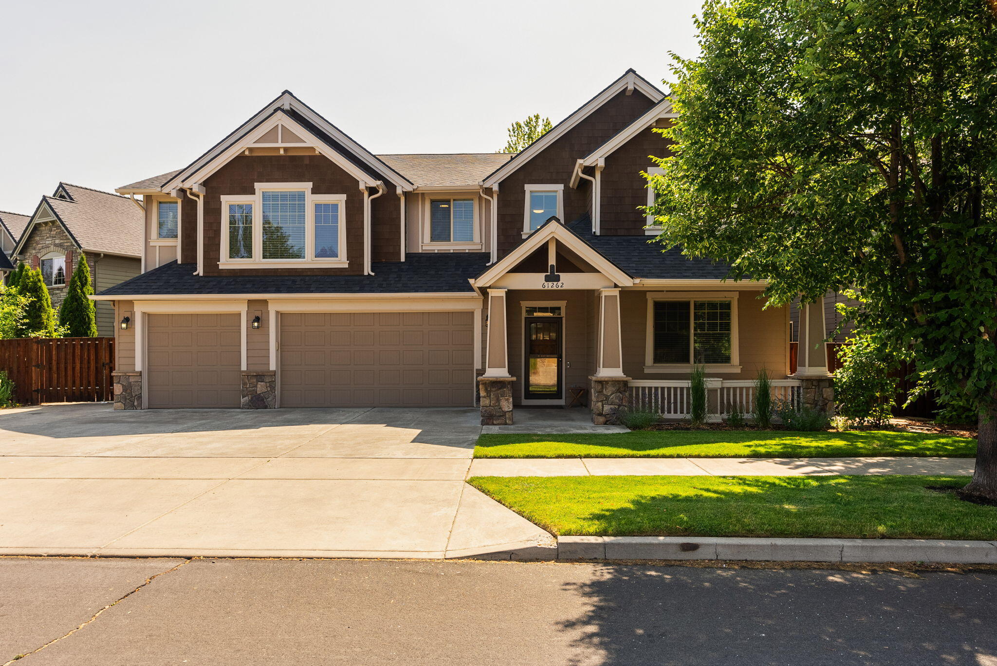 Welcome to your dream home in one of Bend's most sought-after communities! This stunning 3,465 sq. ft. residence offers the perfect blend of space, comfort, and modern updates on an expansive 7,870 sq. ft. lot. Featuring 5 bedrooms—including one conveniently located on the main level—plus an office and a large bonus room, there's plenty of room for everyone. Step inside to beautiful hardwood floors, an updated kitchen designed for gathering, showcasing a massive custom granite island, Boos butcher block counter, and a must-see pantry. The open floor plan seamlessly flows to your private backyard oasis, where a covered patio with a stone fireplace, built-in BBQ, and beverage cooler make entertaining a breeze. A dog run and gated RV pad add convenience and versatility. Enjoy the incredible neighborhood amenities, including a community pool, playground, and easy walking distance to Elementary School and Alpenglow Park.
