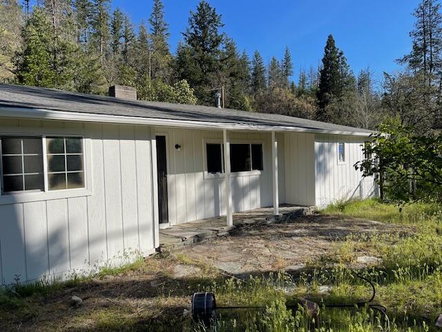 RIVERFRONT Home! Here is your dream opportunity to own a home on the  Applegate River. This property may be yours. Located along the Applegate River, approximately 20 miles from Jacksonville, on your way to Applegate Lake.  One of the most affordable riverfront homes  in Southern Oregon. Extensive renovations have transformed this gem into a very comfortable Estate. There has been new floor coverings through out, new  paint inside and out and all new plumbing.  You need to check out the large man cave complete with a wet bar. Outside there is a large flagstone porch to sit and listen to the river glide bye.
The spacious Livingroom boast a huge 4 foot wide fireplace. The adjacent lot # 400 is also available for a two family set up. The artesian well was 45 GPM when drilled and has a new pump. Please do not go to the property without an appointment and respect the neighbors privacy. No showings until after               11-30-2025 Thank you!