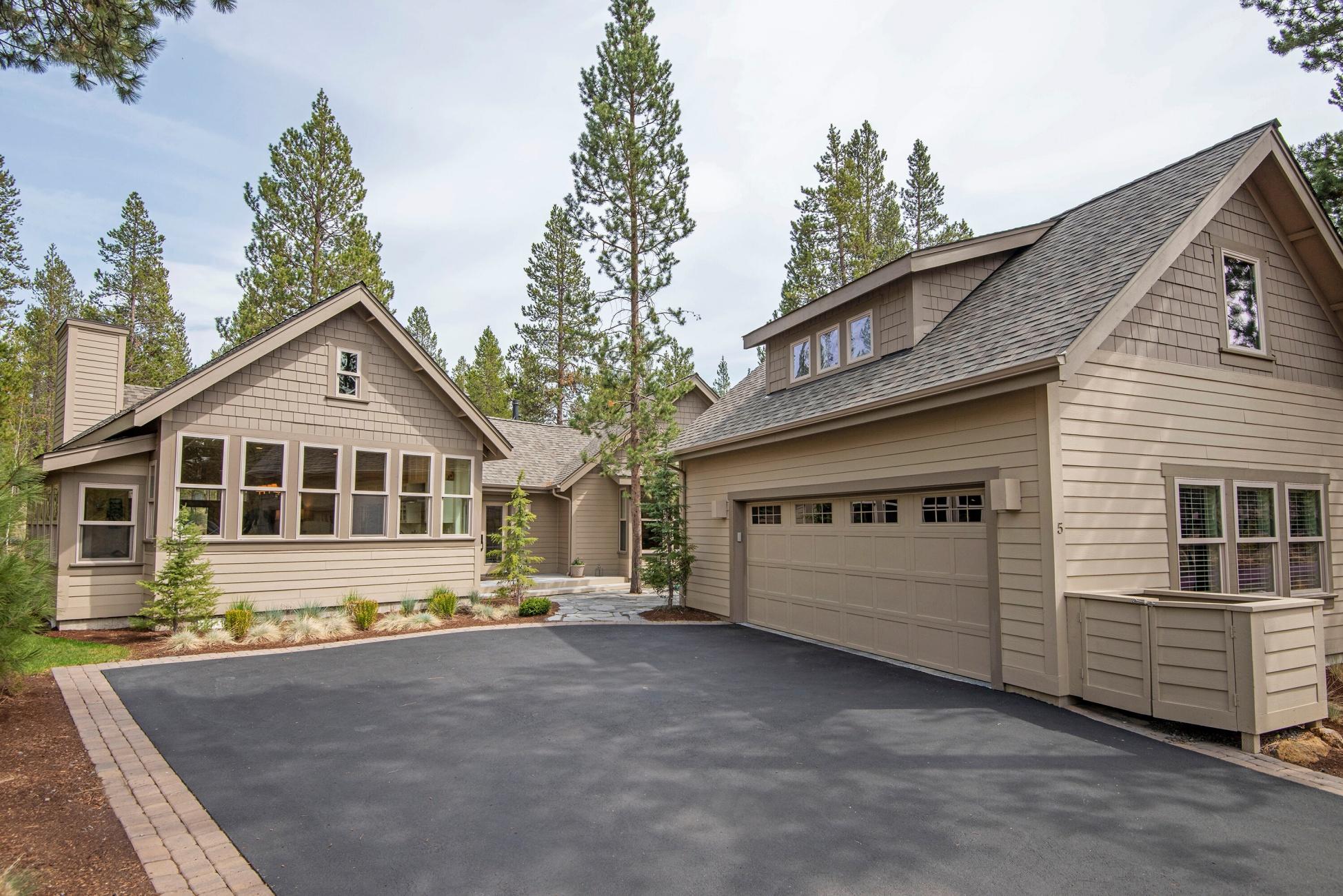 Single level custom cottage, tucked away on a quiet cul-de-sac, backs to open common area with bike path access. Approaching the home, you pass through a private courtyard and into a generous foyer with forest views. The great room design enjoys vaulted ceilings, built-in shelving, wrapped wall-of-windows along both the kitchen and dining alcove, gas fireplace, and a spacious kitchen with numerous custom touches including pull up mixer stand, pull out pantry, and dual fuel range. The primary bedroom has direct access to the large rear deck and is adjacent to a functional office with built-in shelving and desk. Primary bathroom includes walk-in shower, soaking tub and a large walk-in closet with custom closet package. Two guest bedrooms, one with built-in murphy bed, both with bed-sized window seats. Over the garage you will find an additional bedroom + full bath, a perfect mother-in-law apartment or light filled creative space. Character, style and quality in an ideal setting.