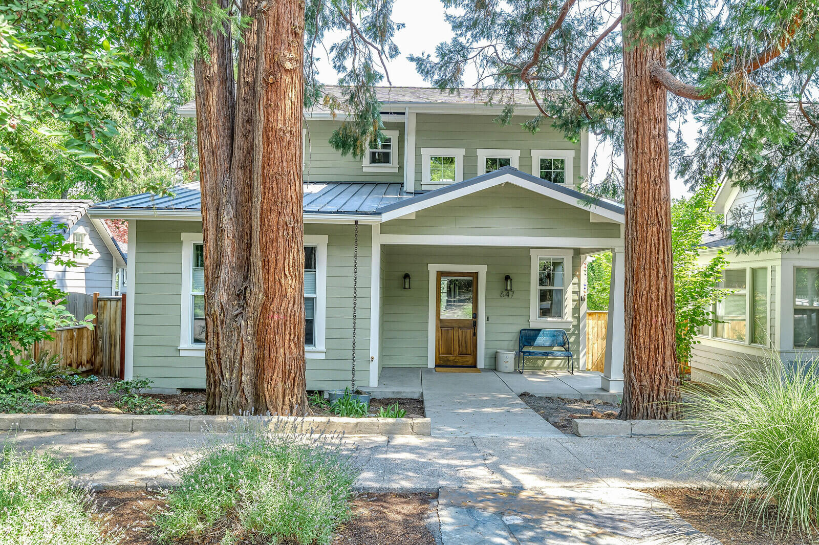 Beautifully constructed home in the heart of Ashland's Railroad District. This professionally designed 3bed, 2.5 bth home + office features quality up to date finishes with spacious living areas, large windows, sliding doors and a gourmet kitchen w/large island. Main level master with large walk-in closet and beautiful bathroom with Carrera marble double vanity, tub & walk-in shower. In addition, you will find 2 spacious bedrooms and a full bath with an oversized soaking tub and tile surround. 10-ft. ceilings and an abundance of natural light add to the grace and feel of this fantastic house! Close to schools, parks, bike path, Shakespeare Festival and all that downtown Ashland offers. Enjoy the yard & mountain views from the expansive covered decking. Legal separate studio with full bath & kitchen same quality finishes as main house that include washer/dryer, deck & separate address/meter. Two car finished garage with electric car charging station.