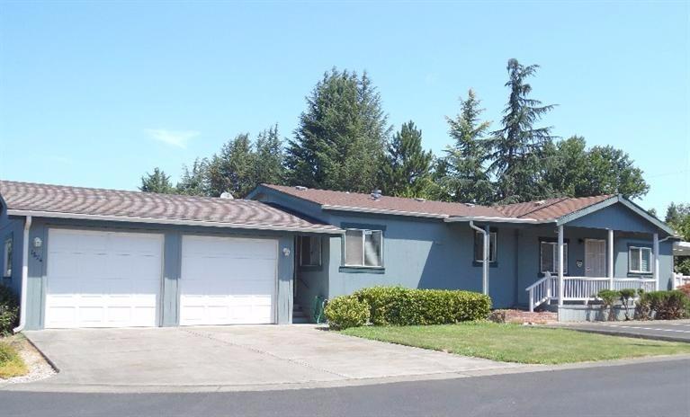 Immaculate 1300+ square feet. This manufactured home on a foundation is located in highly desired 55+ park. It features an open floor plan with vaulted ceilings and a large master bedroom. Master bath has a garden tub. Two car garage includes a workshop.