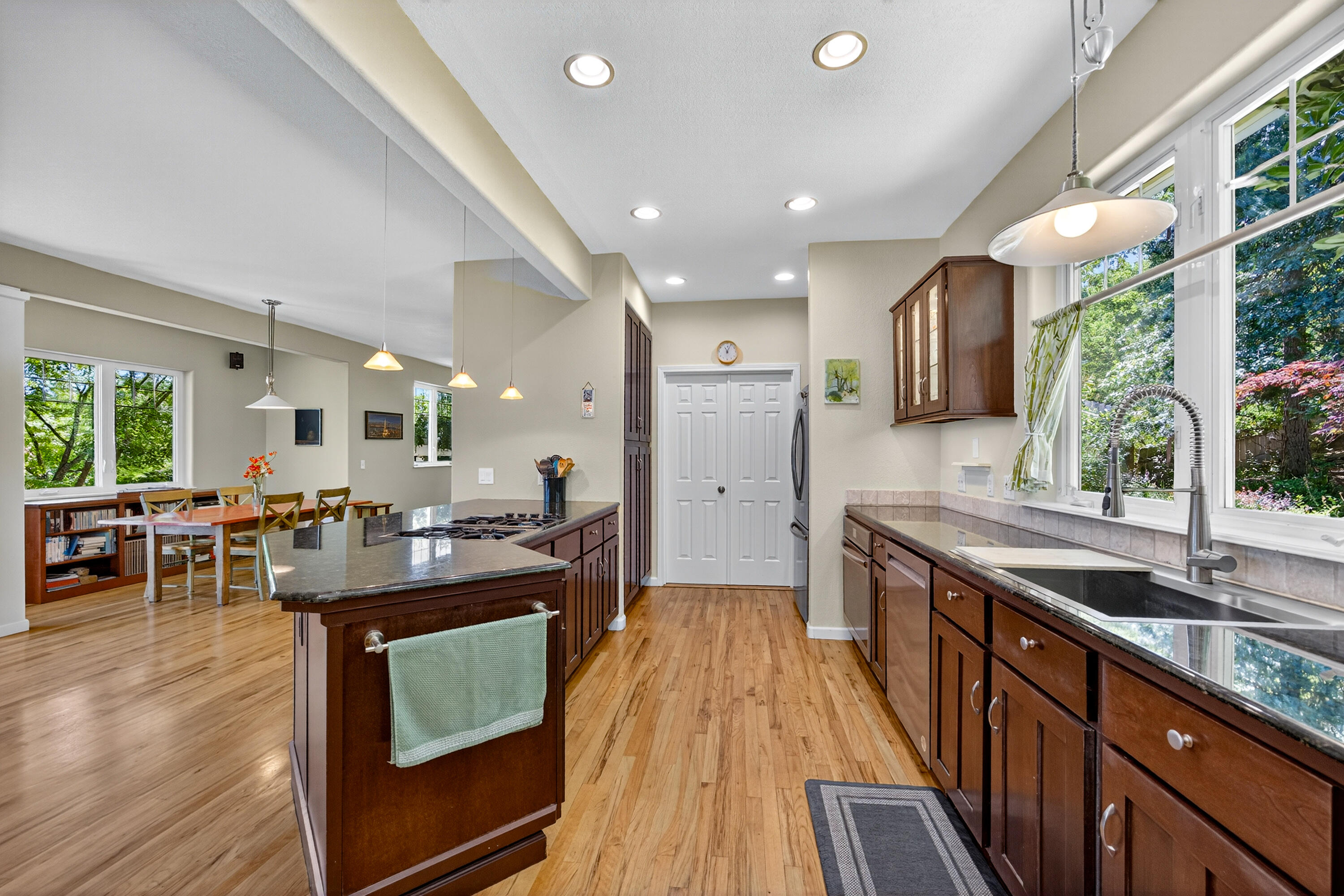 Wonderful, well-maintained home set back from the street on a quiet cul-de-sac, in a neighborhood w/ a creek and access to a vast network of nature trails. This three bedroom, three bath home of approx. 2185 SF, has so much to offer! Nestled in w/ pathways, flowering shrubs and mature plantings, creating a lovely overall setting. Main level of the home offers an open floor plan, spacious kitchen w/ granite countertops, stainless steel appliances and eating bar overlooking the living and dining room areas w/ access to the large back deck, picturesque views of Grizzly Peak, perfect for indoor/ outdoor enjoyment. There's also a versatile space off from the dining area that is currently being used as a music room. Lots of options depending on lifestyle needs! Up the impressive staircase, there are two bedrooms w/ a shared bath, laundry and a spacious primary bedroom suite w/ tall a tall ceiling and wall of windows for those views! This is a great house awaiting the next owners to enjoy!
