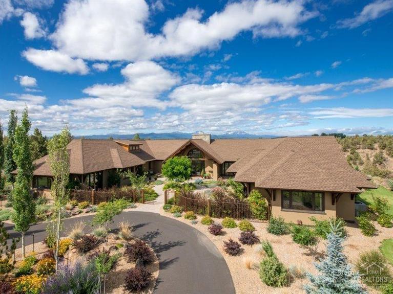 Spectacular Rozewski designed 6,600 SF home on 2.5 acres in Deschutes River Ranch within a serene pastoral setting. Enjoy magnificent Cascade Mountain & Deschutes River views. Features reclaimed beams, floor to ceiling rock fireplace, custom windows & doors plus an open floor plan with mostly main level living. Numerous fenced outdoor spaces for entertaining, impeccable landscaping & a large barn with finished guest quarters above. DRR offers riding trails, private river access & borders BLM land.
