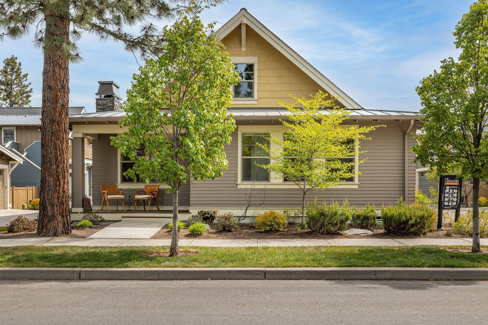 Live in the heart of NW Crossing in Bend. With Craftsman-inspired curb appeal & the privacy of a detached home, Step inside to vaulted ceilings, hardwood floors, & a gas fireplace that anchors the open-concept great room—perfect for cozy nights & entertaining. The kitchen is equal parts style & function, featuring newer appliances including Bosh Dishwasher & tile accents. A spacious primary suite & a 2nd bedroom offer flexibility for guests, or creative space. Enjoy the covered deck or unwind in the fenced yard w/ a flagstone patio framed by mature landscaping & a garden w/ raised herb beds. The attached 2-car garage includes custom storage solutions, while a tankless water heater & ductless mini-split system ensure efficiency & comfort year-round. The HOA takes care of the details—landscaping, snow removal (including alleyways & sidewalks), water, sewer, insurance, & reserves—so you can spend more time enjoying the vibrant shops, parks, & eateries just blocks away!