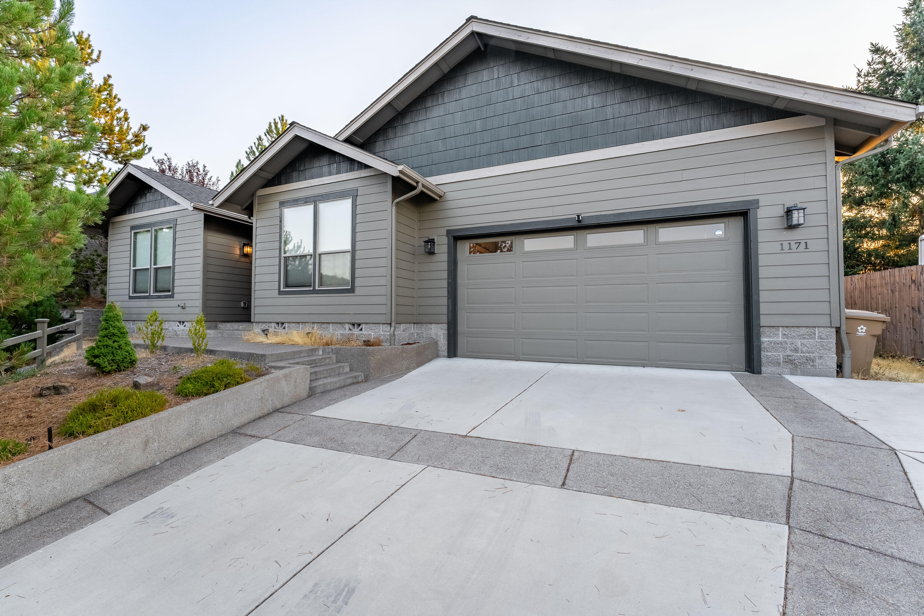 Experience breathtaking views and modern comfort at 1171 NW Starlite Place, a stunning custom built 3 bed, 2 bath home offering 2,008 sqft of thoughtfully designed living space. Built in 2018 on a .53 acre lot in the prestigious Starlite neighborhood, this property is ideally positioned to capture sweeping panoramic views of the city, valley, and surrounding mountains. The open floor plan is perfect for both everyday living and entertaining, featuring a spacious great room with dramatic expansive windows that flood the space with natural light and frame the breathtaking scenery, and a cozy gas stove heater. The chef's kitchen offers granite counters, quality cabinetry, a gas range, breakfast bar, and a large walk in pantry. Upgraded finishes throughout add comfort and style. Energy efficiency is built in with solar power and high efficiency HVAC keeping utility costs impressively low. Step outside to the covered deck to relax and fully take in the extraordinary views.