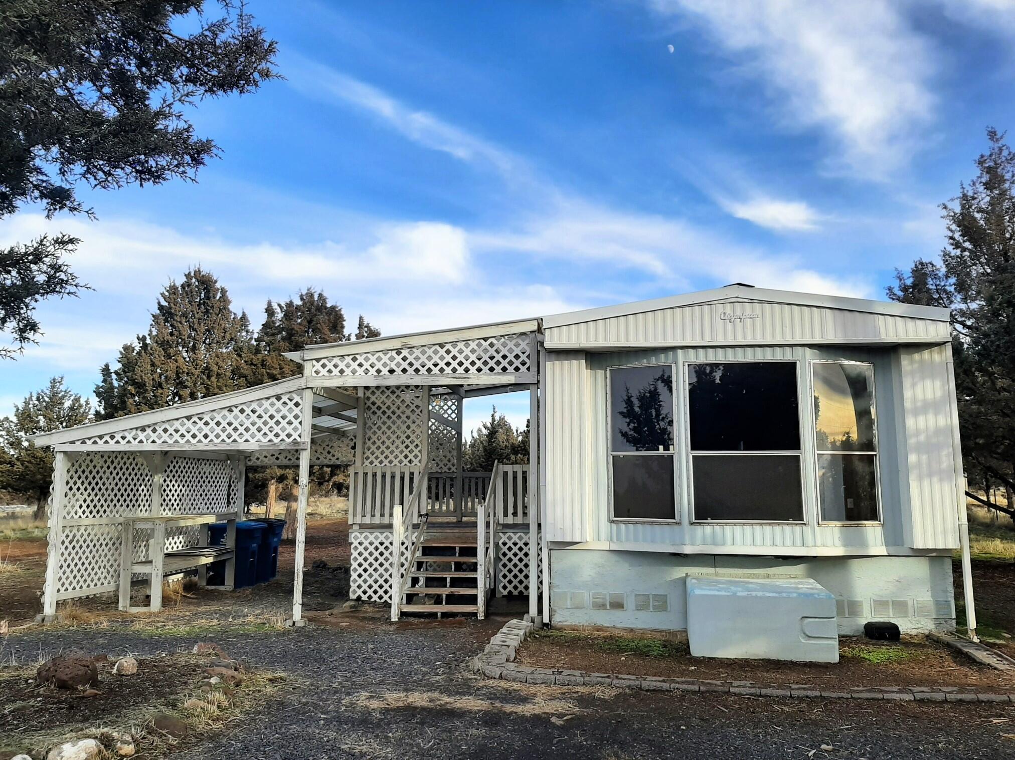 Looking for the right buyer for this one. The right buyer is someone who knows a tremendous opportunity when they see one! 2bd, 1ba, 1981 manufactured home needs a little elbow grease to be awesome, but is perfectly livable as is - or use the existing infrastructure for your own plans. The property itself is also loaded with potential. 1.71 flat acres - plenty of room to add a shop/ barn/ greenhouse/ chicken house/ dog house/ animal house... there's even a little shed to get you started. Part of the property is completely fenced in which is great to keep a variety of critters from running off. Priced to sell no matter what your plans might be. It's a place in the country to call your own - come take a look!