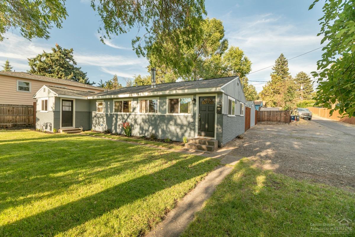 Great mid-century modern in mid-town Bend; a short walk away from everything include shops and Juniper Swim & Fitness! And behold, the Pilot Butte fireworks from your very own backyard - that is a tranquil escape from the hustle and bustle of local business and activity nearby. This home has been partially updated in the kitchen, master, new roof and vinyl windows, but the character and charm of the beautiful refinished original hardwood floors throughout takes you right back to the 1950's. The exterior features a large lot, old growth trees, outdoor living for hospitality and not to mention, last but not least, an expansive craftsman's workshop/studio. Don't miss out on this great find!