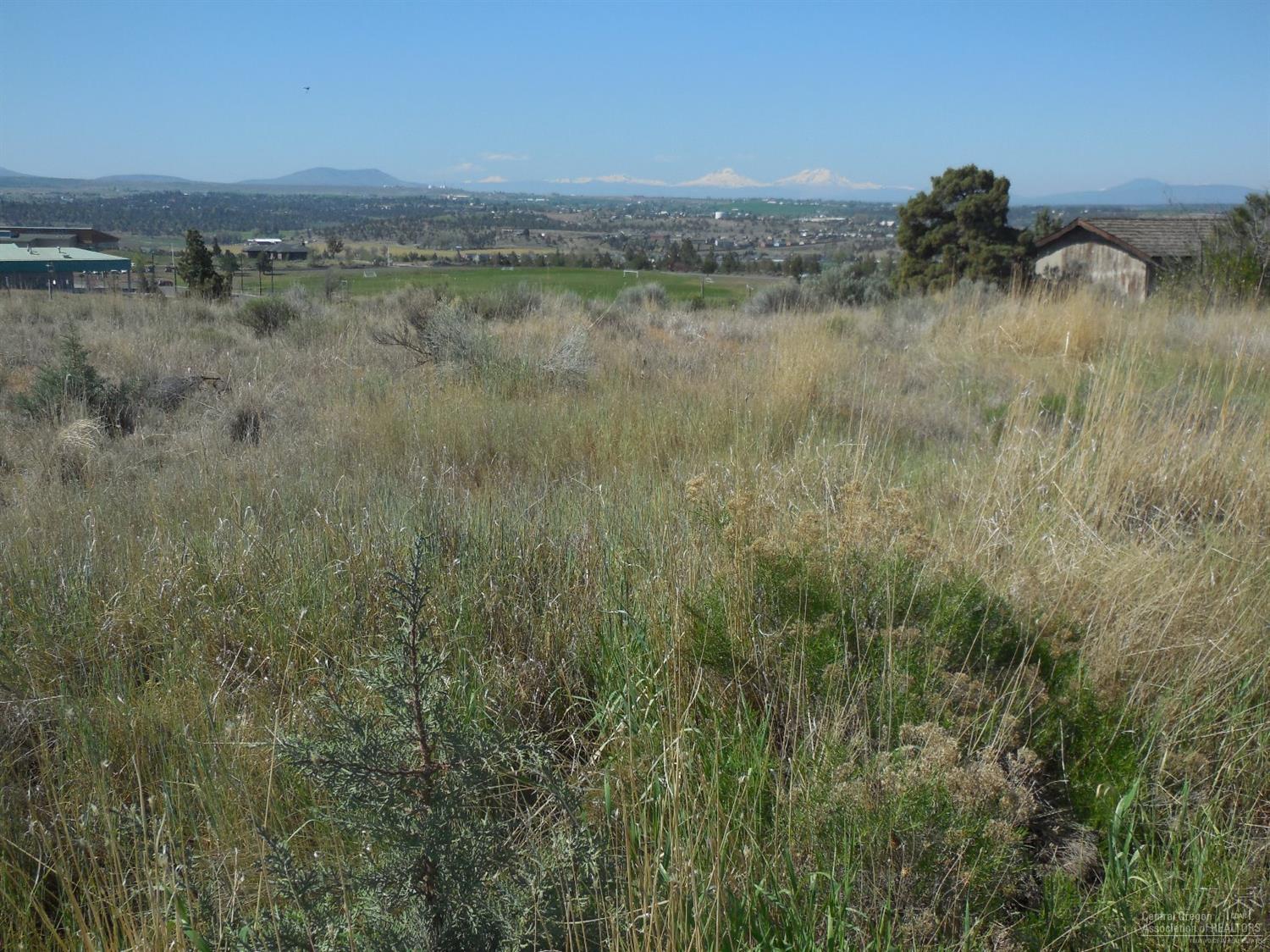 Fantastic view property on the rim above COCC. Great view of the Three sisters, Broken Top and Mt. Jefferson.