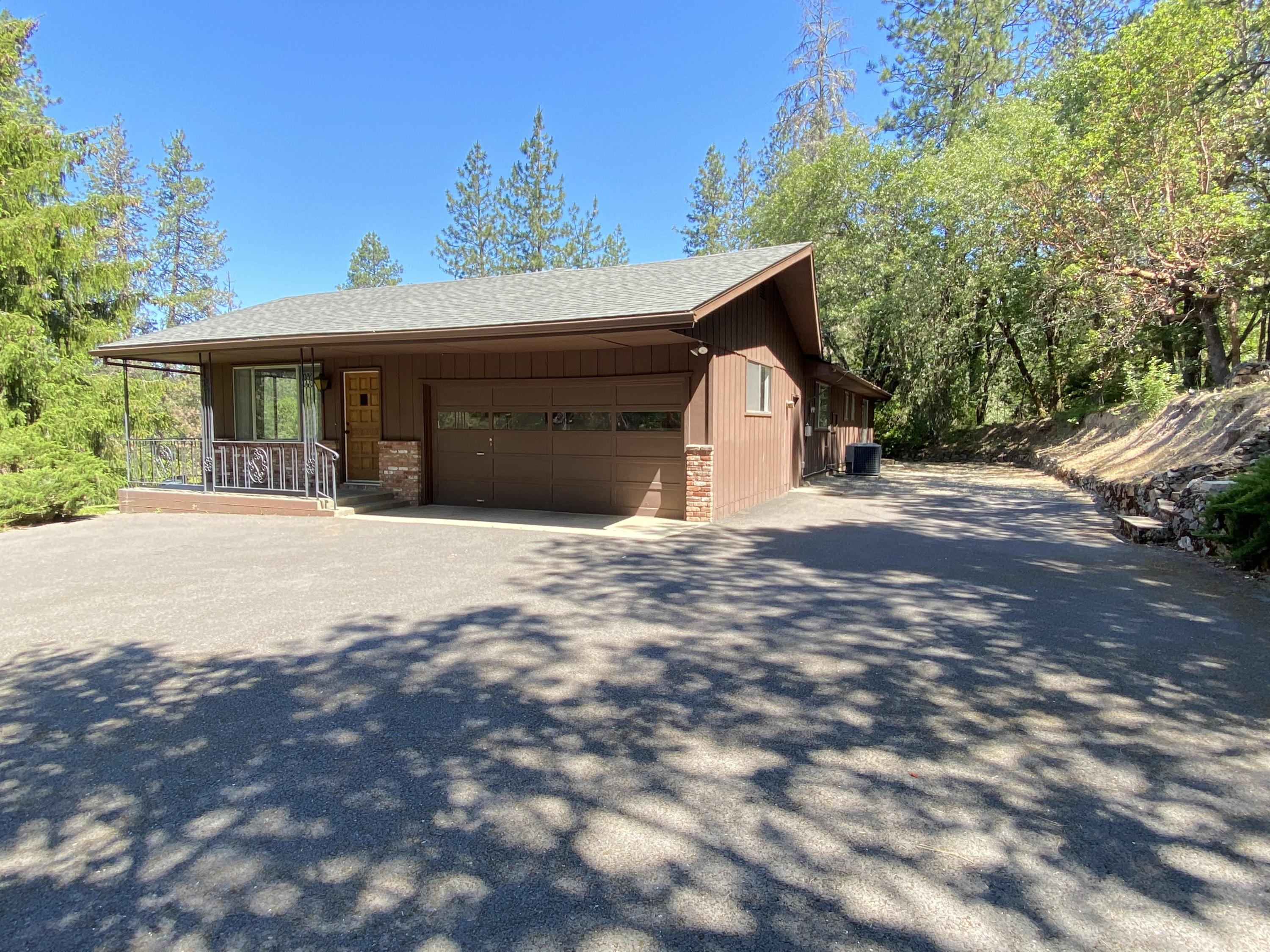 Hard to find a very solid home on the south side of Grants Pass like this home. This one level home with 2 car garage has been well maintained. There is a paved driveway and RV parking. Home has a nice country feel since it sits back from the road. You can enjoy the west facing views from the kitchen and living room. Recently replaced the carpet and installed a new roof, updated kitchen cabinet color and new range-oven and dishwasher. Located about 2,000 feet from the Grants Pass Golf Club and Cathedral Hills Trail system County Park Espey Road entrance. Also in district 7 school system. There is a large shed that can be used for as a workshop or storage or gardening shed. Owner open to negotiate owner carry terms with a sufficient down payment.