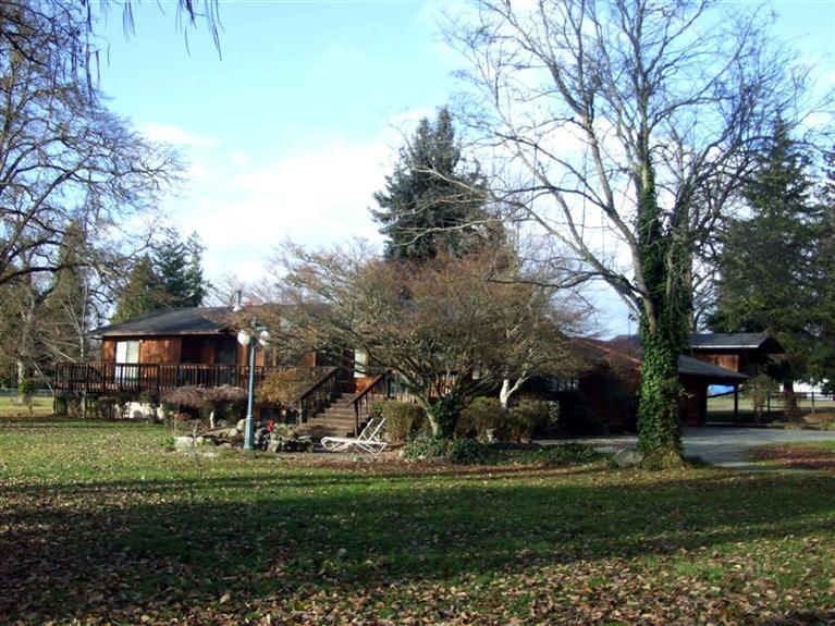 Fully Furnished Contemporary 3bd/2.5ba 2043 Sqft Home with 900sft daylight basement not included in the square footage on 2.27 level park-like acres on the Rogue River. Amazing views from your deck as well as the master bedroom, familyroom, dining area, kitchen and living room. 3 car garage, double carport and covered RV parking. Large fenced pasture area, delightful water feature and decks to enjoy those summer evenings. New well pump and rear deck just installed. Owner Financing Possible!