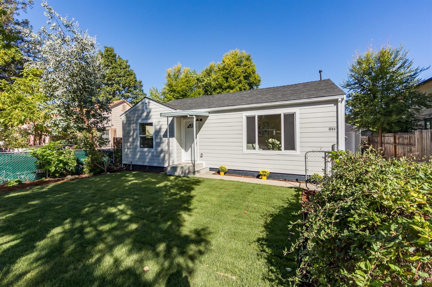 This beautifully renovated home that feels brand new, boasts a brand new kitchen, brand new appliances, laminated wood floors, complete new bathroom, roof and siding. Make this your home and enjoy the large trees that frame the front of the home and the large completely fenced back yard. High end finishes complete the stunning decor of this home.