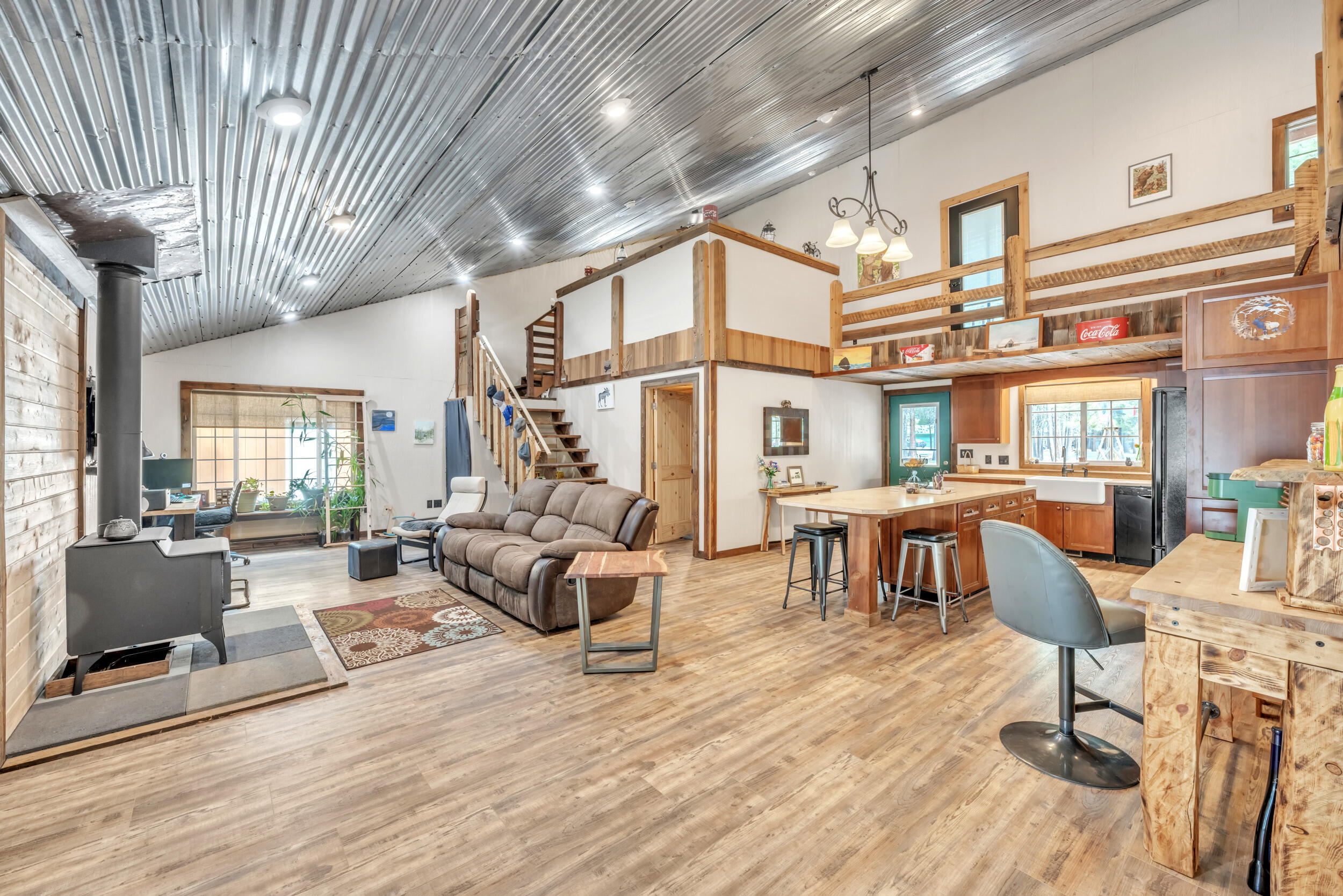 Step back in time—without sacrificing modern comfort—in this one-of-a-kind rustic western saloon-style home, tucked among the majestic Ponderosa Pines of Central Oregon. With timeless character and authentic charm, this unique property blends the bold spirit of the Old West with today's modern amenities. Just minutes from pristine lakes, winding rivers, and scenic mountain trails, it offers year-round adventure—from fishing and hiking to kayaking and snowshoeing.
Whether you're seeking a full-time home, weekend escape, or vacation rental opportunity, this saloon-style gem is a rare find. Embrace the wild beauty of the West—with all the comforts of home.
Updates include new laminate flooring, interior paint in the living area, new clawfoot tub installed.
Full RV hookup, direct access to trail riding for recreational fun, property pins already in place, septic will be pumped with accepted offer