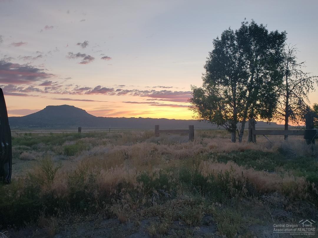 Make your dreams a reality? Just imagine the possibilities this 320 acre fenced parcel will give you! Here you will find a 2,200 sq ft home plus a huge hay barn 75x250 a shop that is 40x60 with 3 phase power with attached carport. Ground was used for cattle and hay. Only 1 mile from paved road and 90 mins. from Bend. Wildlife,starry skies, gorgeous sunsets and Indian artifacts await you.There are two wells one house and one irrigation. Don't let the deal of the century pass you by.