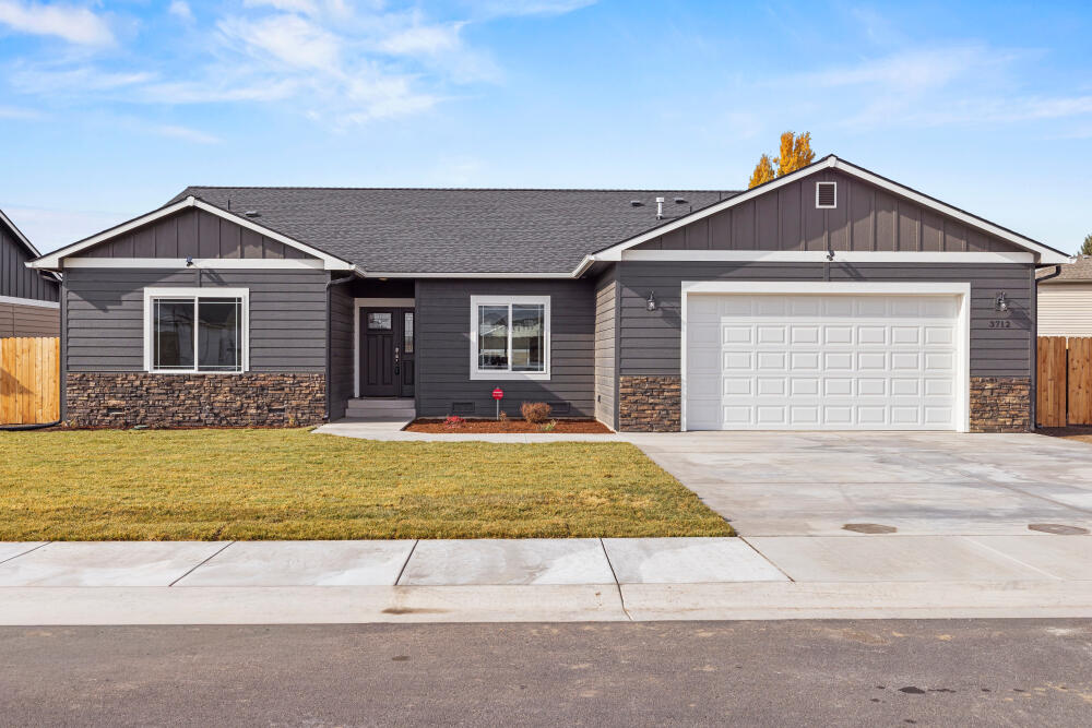 New Tom Soyland built home in the desirable Sunset neighborhood with other Soyland quality-built homes. This semi-custom home provides a high level of quality with multiple coffered ceilings The master bedroom has a large master bath with oversized shower plus an oversized deep soak tub and a walk-in closet. The home provides 2267 Sq ft of inside living space and the outside covered deck provides added outdoor living. The garage has a simple pull-down attic ladder for additional attic storage. Instant hot water is a standard feature along with granite counters and custom cabinetry that reach all the way to the 9' ceilings. Custom coffered ceilings in the dining, kitchen, office and master bedroom really give this home a special look and feel.  It's a new home with front and back yards already in with sprinklers, lawn and privacy screen planted in back. Tom Soyland has built well over 400 quality homes in our community. Call for an appointment today. Set up as 3 bedroom and 1 office.