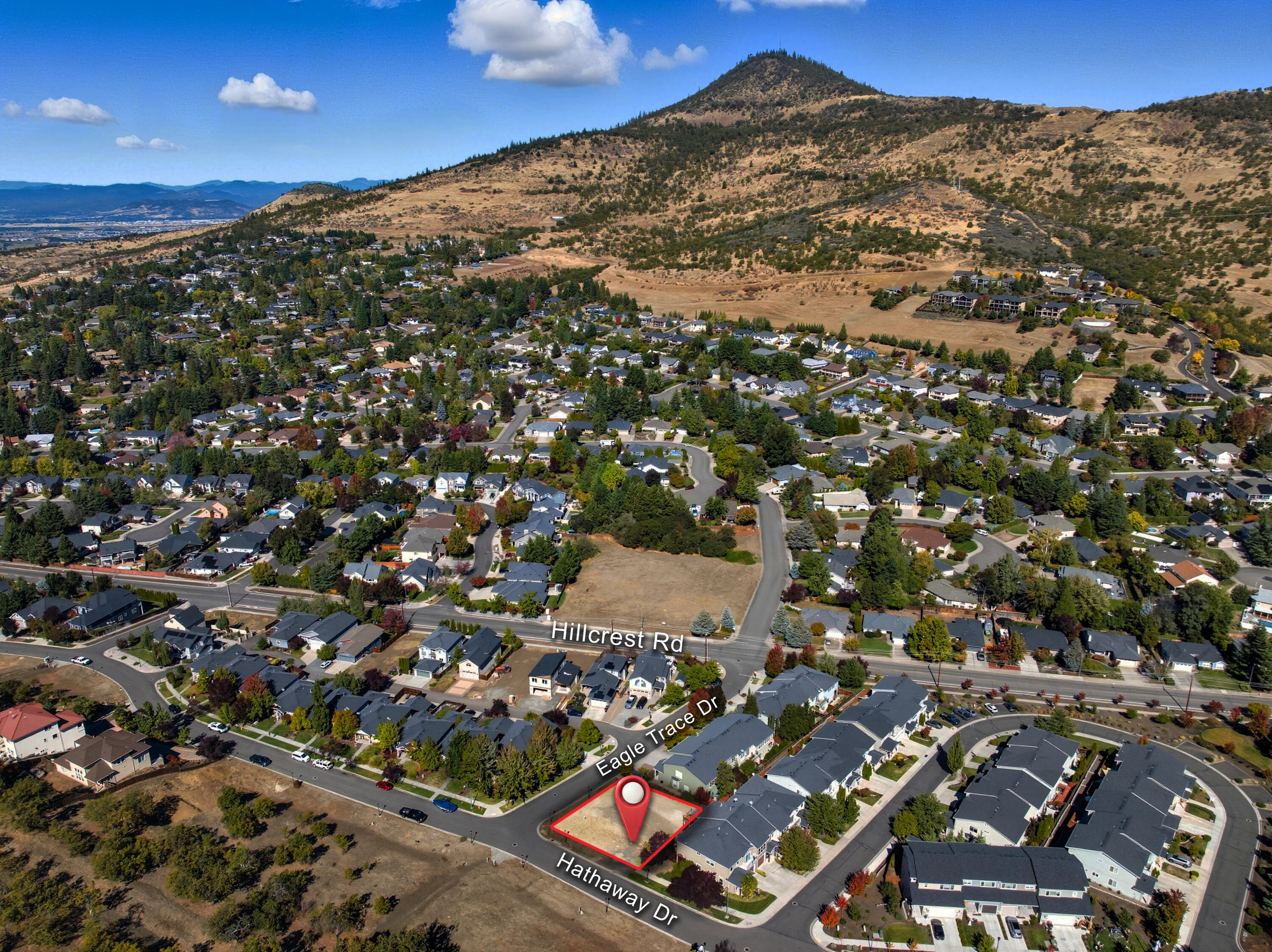 Get ready to build! This offering is for 2 adjacent level townhome lots in desirable established East Medford. Each lot is .05 acres. The neighboring existing townhomes are attractive and create a lovely community and according to the county, one neighboring adjacent townhome has a RMV of approximately $400,000. This offering provides sites for 2 townhomes. Open mountain views, easy convenience to schools, shopping and restaurants. Per the city: This phase of the Heights at Hillcrest (Phase 3) is for townhome lots, which are attached units. One unit per lot is permitted, but the units would be attached.