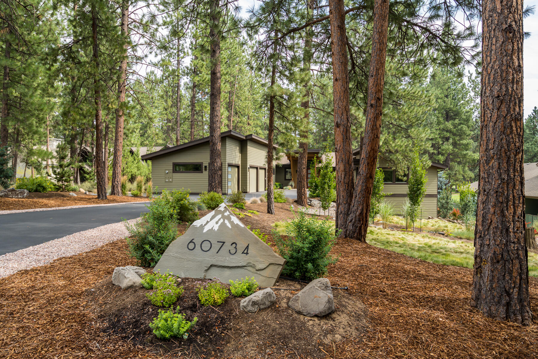 Stunning custom single level home has 3 beds, 2.5 baths, office & bonus room/home gym. 1 bed & bath have private entrance, could be a mother-in-law suite w/washer/dryer in bathroom & kitchenette w/sink, fridge & cabinets. Great room is vaulted w/beautiful wood beams, natural light & floor to ceiling windows. Large composite deck is great to enjoy a cup of coffee or glass of wine as you watch birds & deer along the wooded path. 2 lighted storage areas under home. The 3 car garage w/extra storage & plenty of room for your cars & 220 outlet for electric car/golf cart. 1 of the larger lots in the neighborhood, backs to 8th, 9th & 10th fairway. Gated location in Widgi Creek-off Century Dr-20 minutes to Mt Bachelor skiing, boarding, XC skiing & mtn bike parks/paths. A few more minutes up the road are the high mountain lakes for fishing, camping, hiking, etc. Hiking & biking trails nearby, access to Deschutes River w/in a mile. The community has golf, pickle ball, community center & salon.