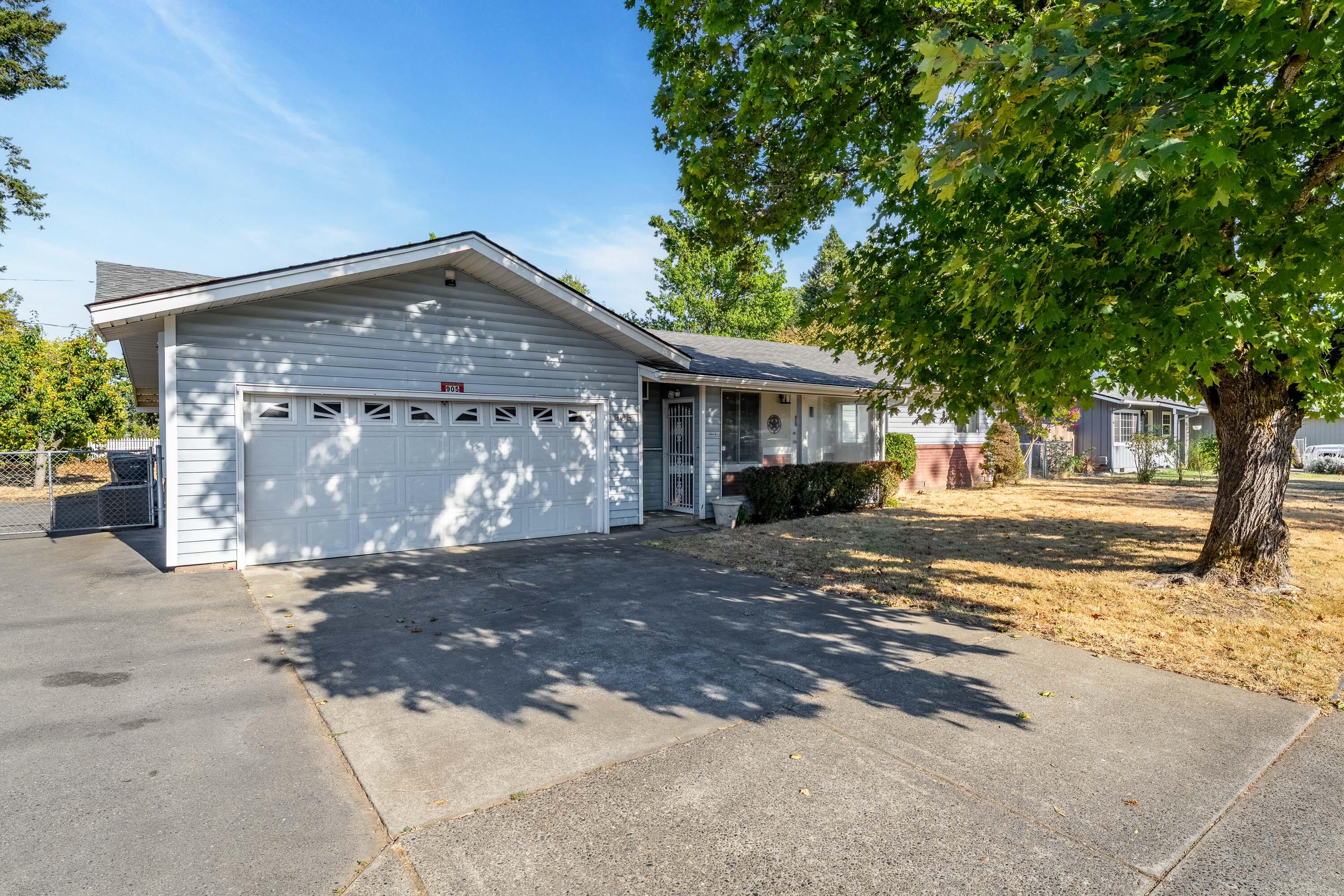 Welcome to this charming 3-bedroom, 2-bath home in a great SE neighborhood!   Step inside to a spacious living room that opens seamlessly to the kitchen and dining area, creating an inviting space for everyday living and entertaining. The huge fenced backyard with a covered patio is perfect for outdoor gatherings, gardening, or play. Bring your RV—this property includes gated parking with full hookups!   A great home in a great location, ready for its next owner!