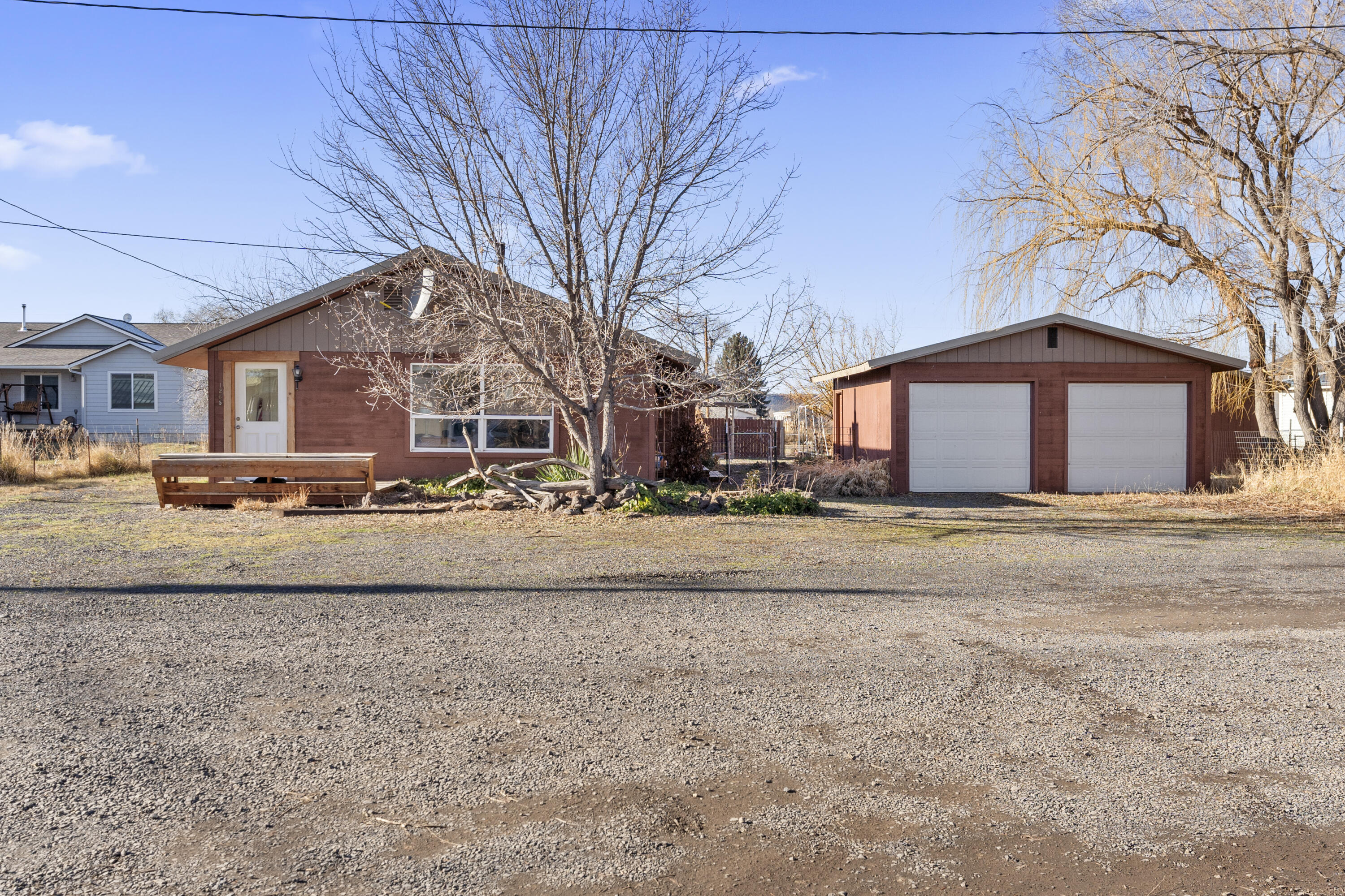 In-town half-acre offering exceptional value and upside. This 3-bedroom, 1-bath home sits on a fully fenced 0.5-acre lot with a durable metal roof and multiple outbuildings, creating a rare opportunity for buyers seeking space, flexibility, and future equity potential.

The property includes a detached shop plus an additional outbuilding, ideal for storage, hobbies, or workspace. Plenty of room for RV parking, trailers, and toys with easy access and generous lot dimensions. Mature trees provide privacy and character, while the fenced yard adds usability and security.

Located within city limits, this property presents strong long-term potential for renovation, expansion, or reconfiguration—buyer to perform all due diligence regarding zoning, utilities, and permitted uses. A solid opportunity for owner-occupants, investors, or buyers looking to add value over time.