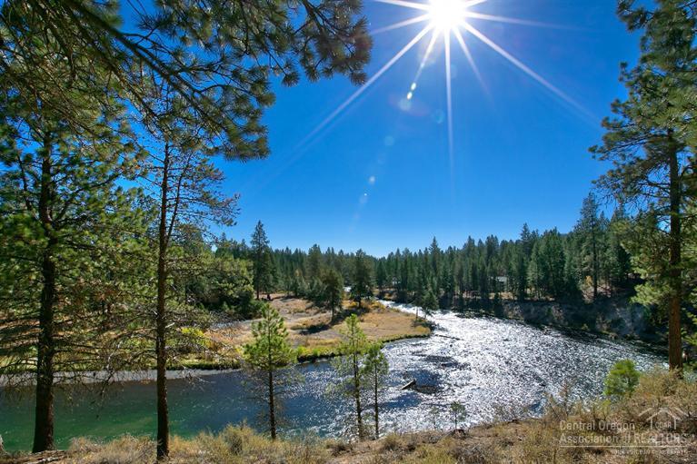 Unsurpassed Pringle Falls views from this impressive entertainer's dream home! Enjoy abundant sq ft of dramatic living space, including two main level en-suite masters, 4 fireplaces, gourmet kitchen with cook's dream range/oven + wood-fired pizza oven, furnished game room w/full wet bar, extensive sound system, and over 2,000 sf of double-tiered all-weather decking. Exceptional offering and great value for large square footage in this sights and sounds rich Big Deschutes riverfront retreat!