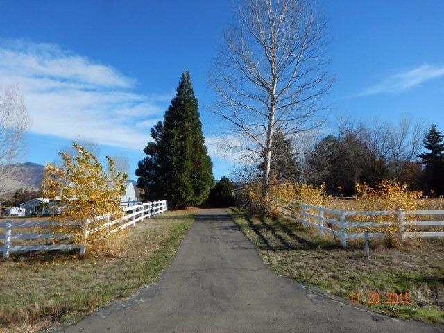 The best of both worlds - rural living, yet still close enough to town for convenience! 3 bedrooms, 2 1/2 bathrooms, a huge barn - for the right buyer, this one is a true gem!