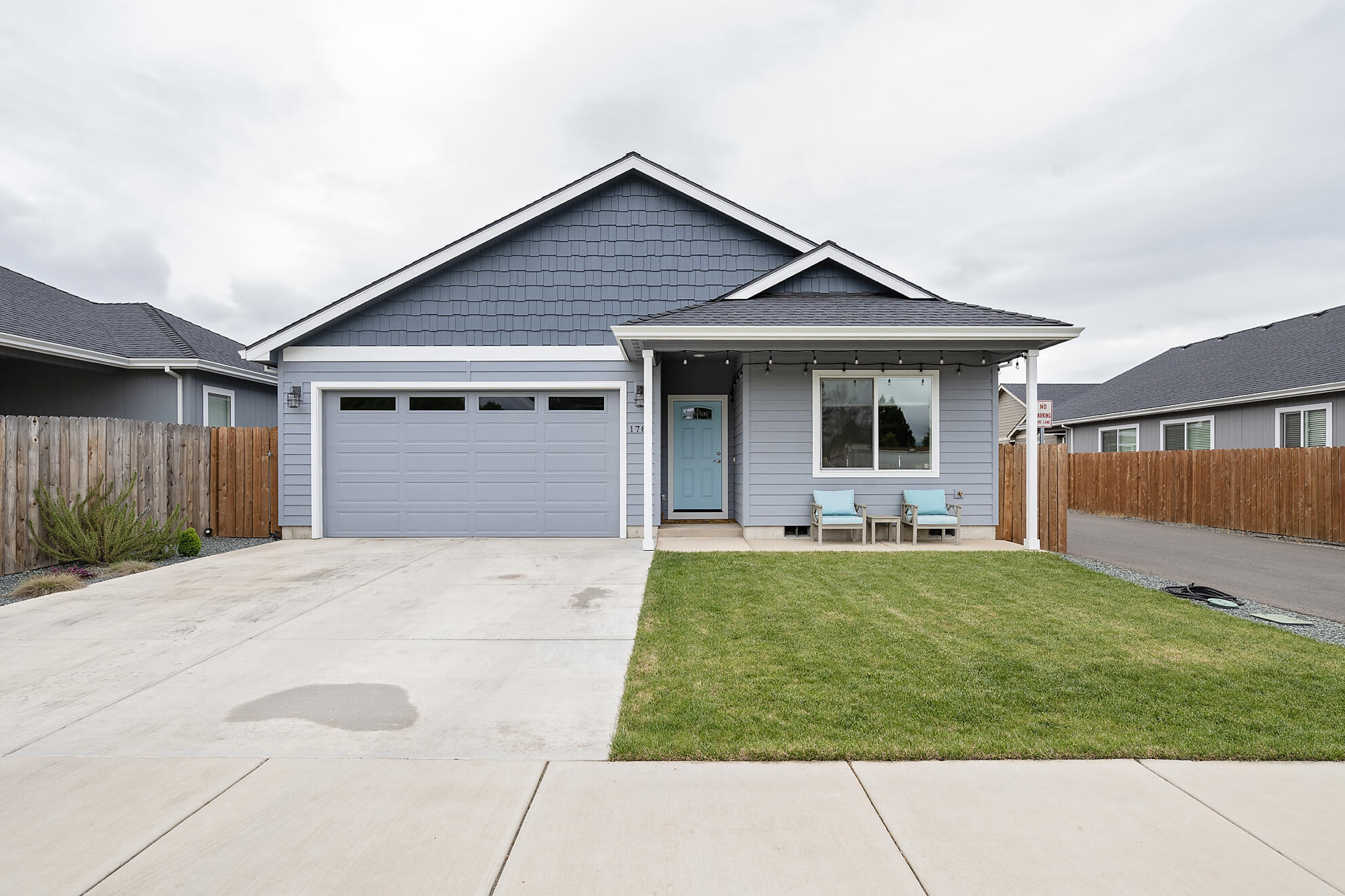 This Southwest Medford home is better than new!  Built in 2020, offering 3 bedrooms, 2 baths with 1500 sq. feet, this open concept plan includes a vaulted great room with ceiling fan and slider that leads out to the covered patio, kitchen with beautiful quartz counters with grey glass subway tile backsplash, island with seating, white cabinets, stainless range/oven, built in microwave and dishwasher.  Primary bedroom has vaulted ceiling with ceiling fan, walk in closet and ensuite bath with dual sink vanity with quartz counters.  Bedrooms are carpeted and the balance of the home features waterproof laminate flooring.  Indoor laundry, attached two car garage, fully fenced low maintenance landscaping with timed sprinklers front and back, drip system, and 10 foot gate accessing the the back yard.  Situated in the South Medford School District...Welcome Home!