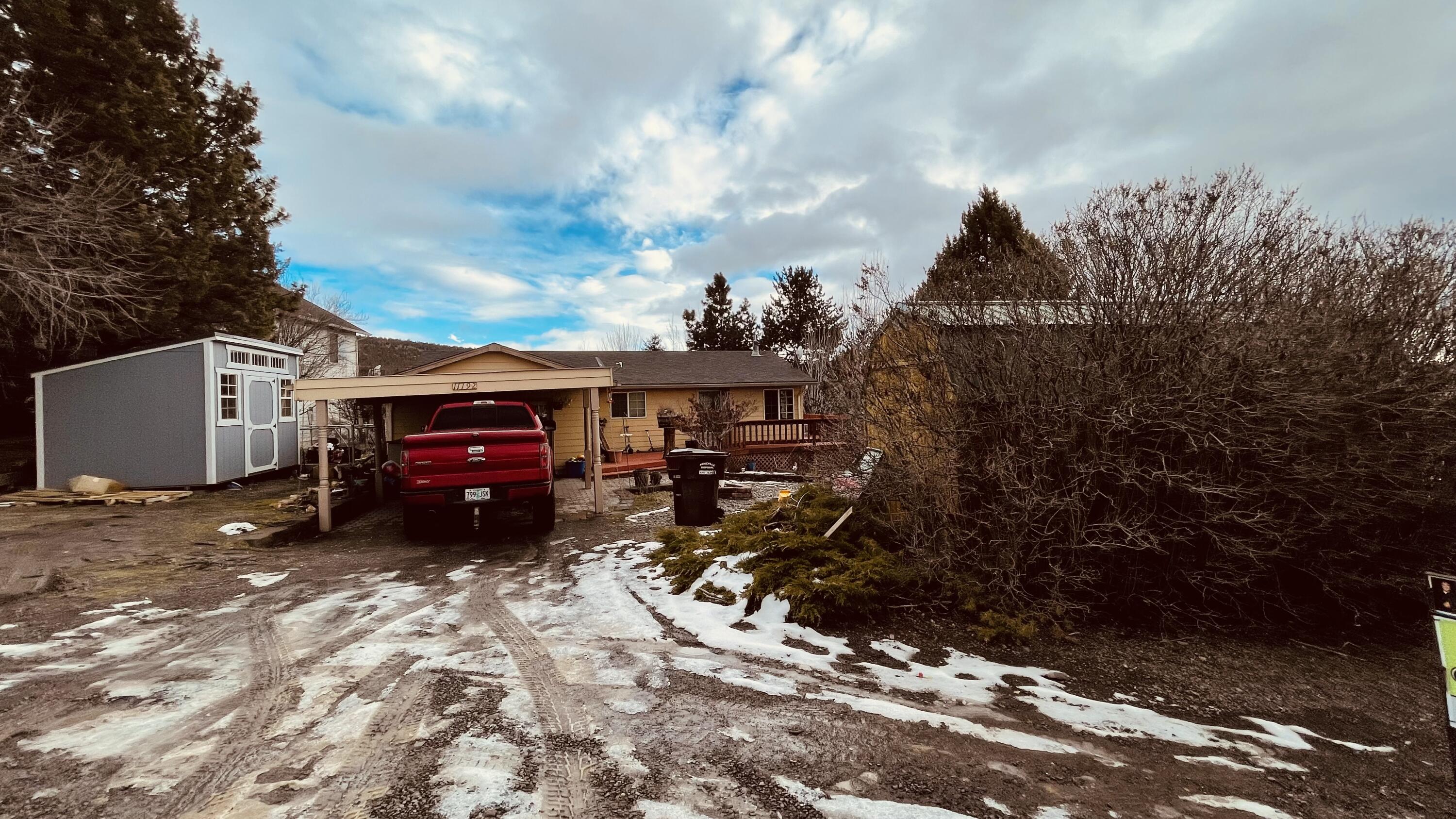 Take in the beautiful valley views while standing on your wrap around deck in this 2 bedroom, 2 bathroom home. Located close to the Ochoco Mountains, this home has a converted garage and mature landscaping that adds character to the home.